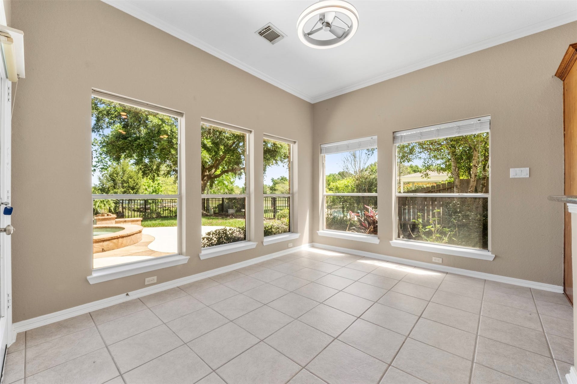 26418 Cottage Cypress Lane, Cypress, TX 77433 Start every morning in pure serenity in this sun-drenched 13x10 breakfast room, wrapped in oversized windows that frame breathtaking views of the lush backyard and sparkling pool and spa. Natural light pours in from every angle, creating an inviting space to enjoy your morning coffee or casual meals with the family.