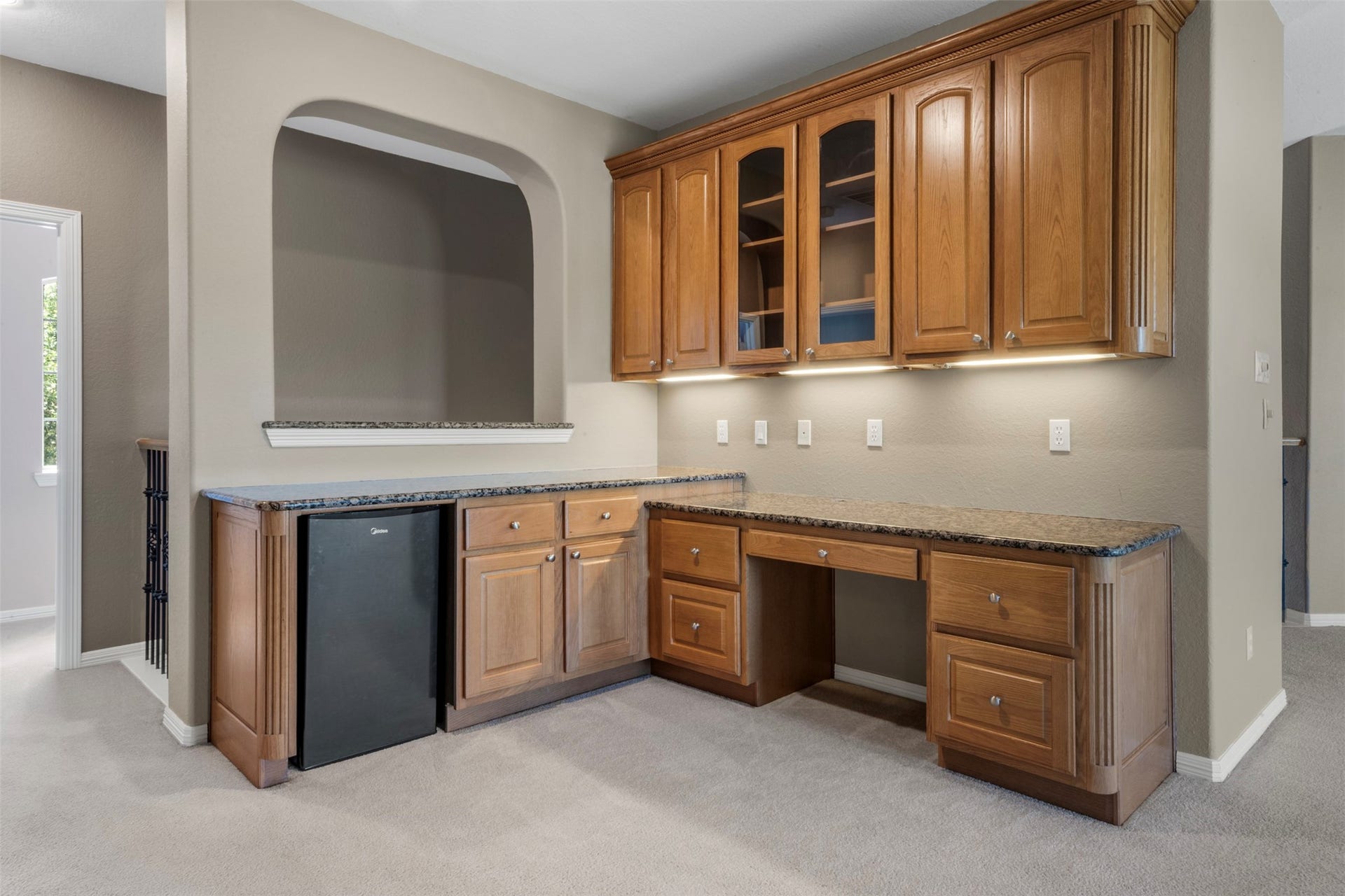 26418 Cottage Cypress Lane, Cypress, TX 77433 Versatile dry bar and desk area featuring cabinetry and countertops, providing ample space and storage.