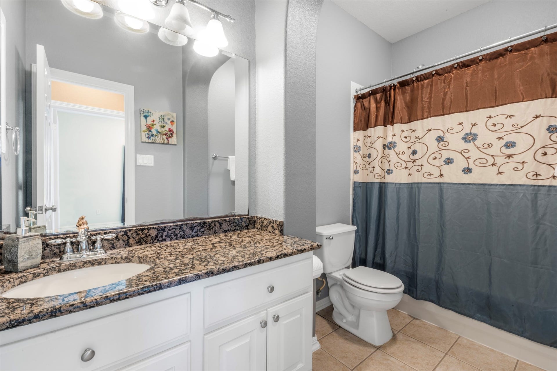 26418 Cottage Cypress Lane, Cypress, TX 77433 A clean secondary bathroom featuring a vanity and a flexible bath/shower combo, creating a fresh and functional space.