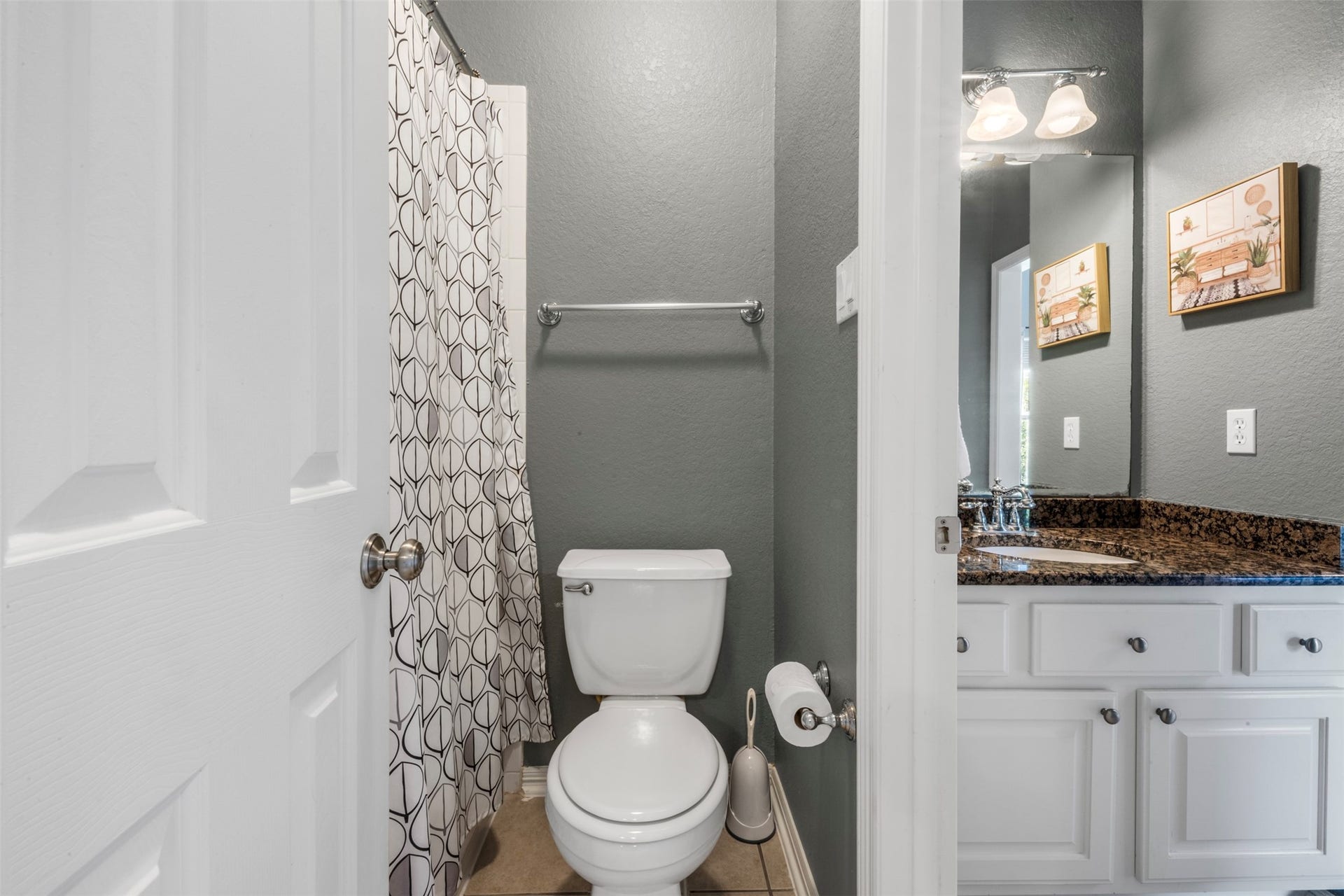 26418 Cottage Cypress Lane, Cypress, TX 77433 A clean secondary bathroom featuring vanity and a private area with a bath/shower combo.