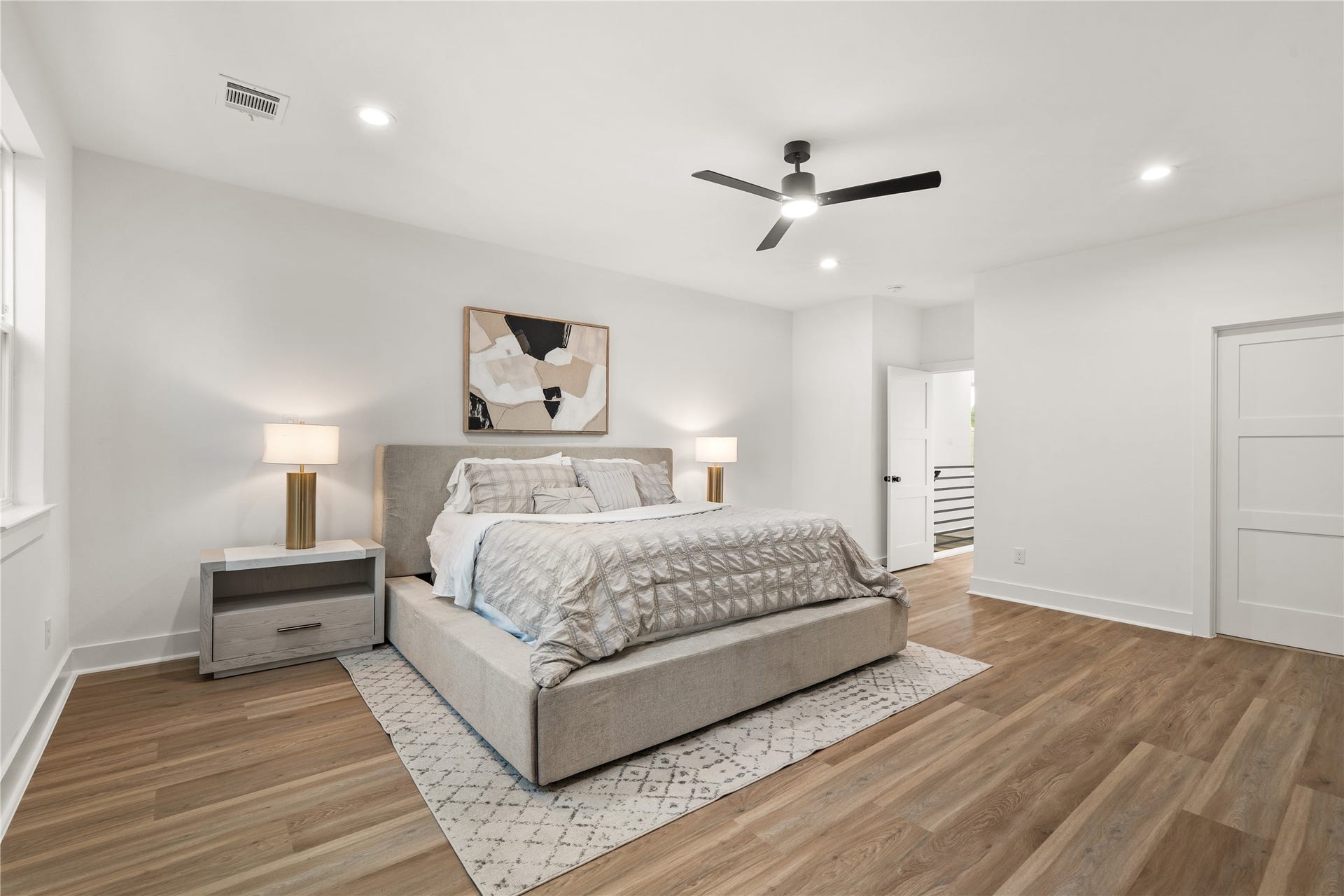 3412 Cortlandt Street, Houston, TX 77018 A second view of the primary suite highlights its thoughtful layout, with recessed lighting throughout and
doors leading to the landing and the primary bath, keeping the retreat private yet connected.