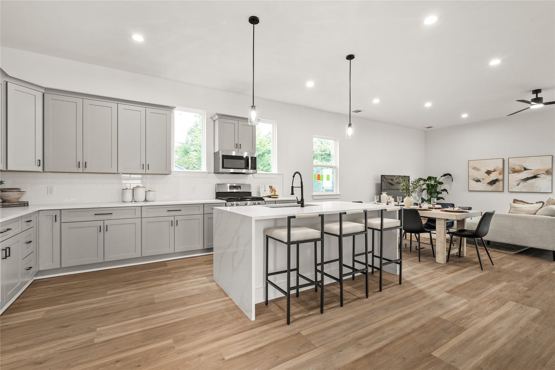 3412 Cortlandt Street, Houston, TX 77018 The kitchen's generous scale is on full display as the island extends toward the dining area and living room,
forming one continuous, light-filled space for everyday living and entertaining.