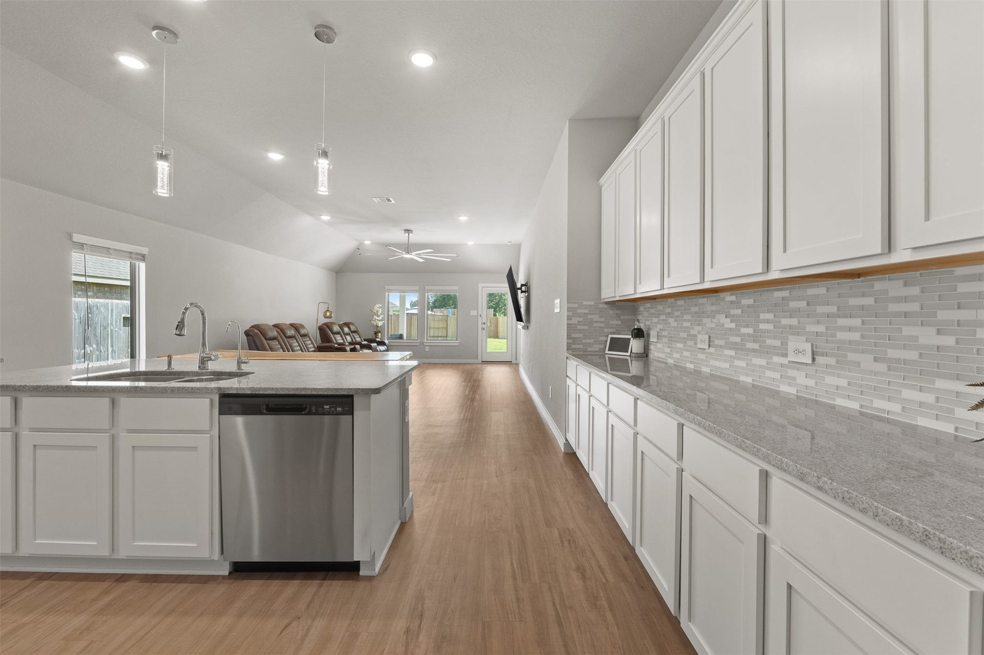 17707 Sapphire Pines Drive, New Caney, TX 77357 Open Kitchen & Living room area with cabinets galore!