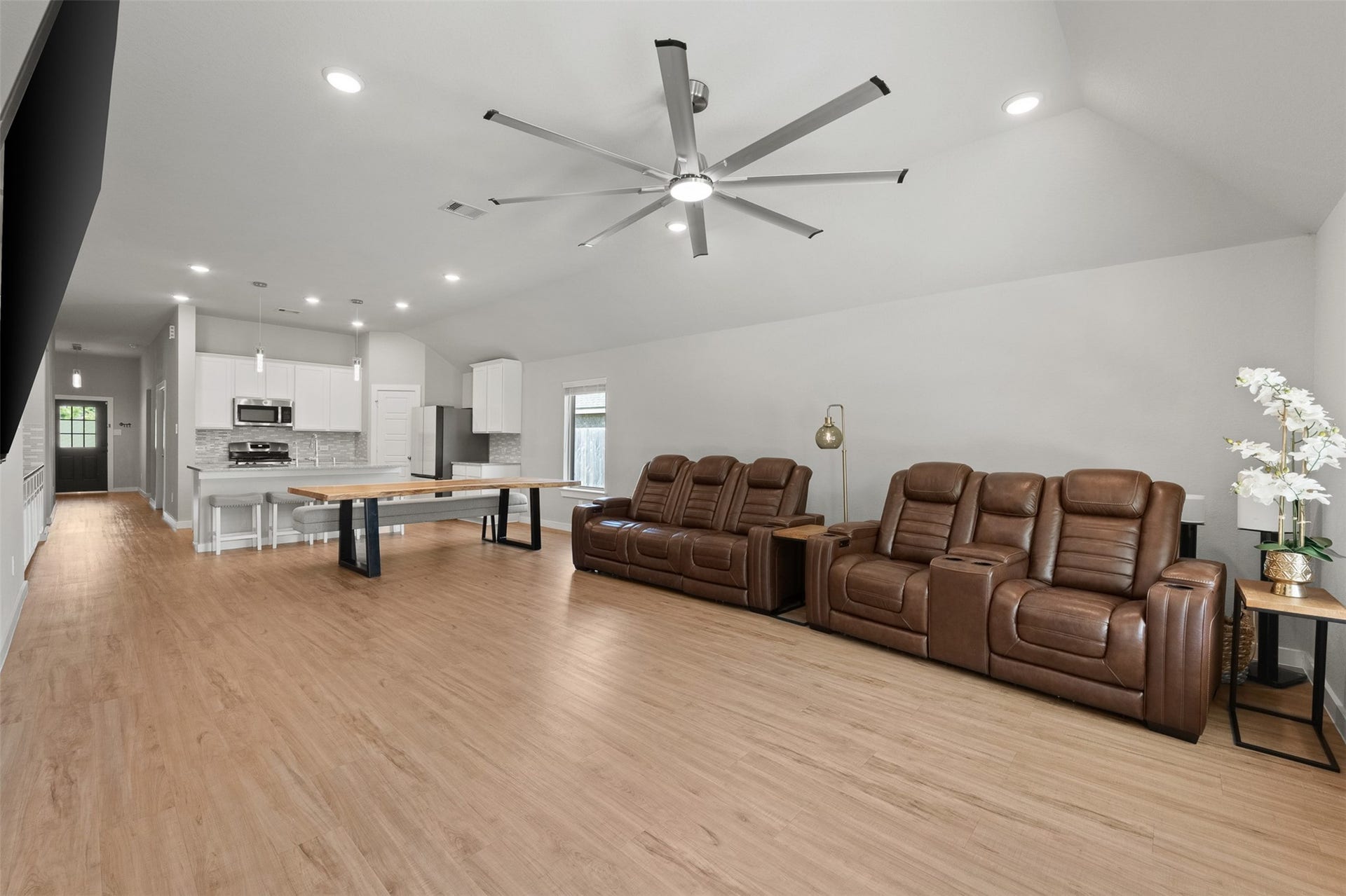 17707 Sapphire Pines Drive, New Caney, TX 77357 The space in the kitchen and living room is even better in person