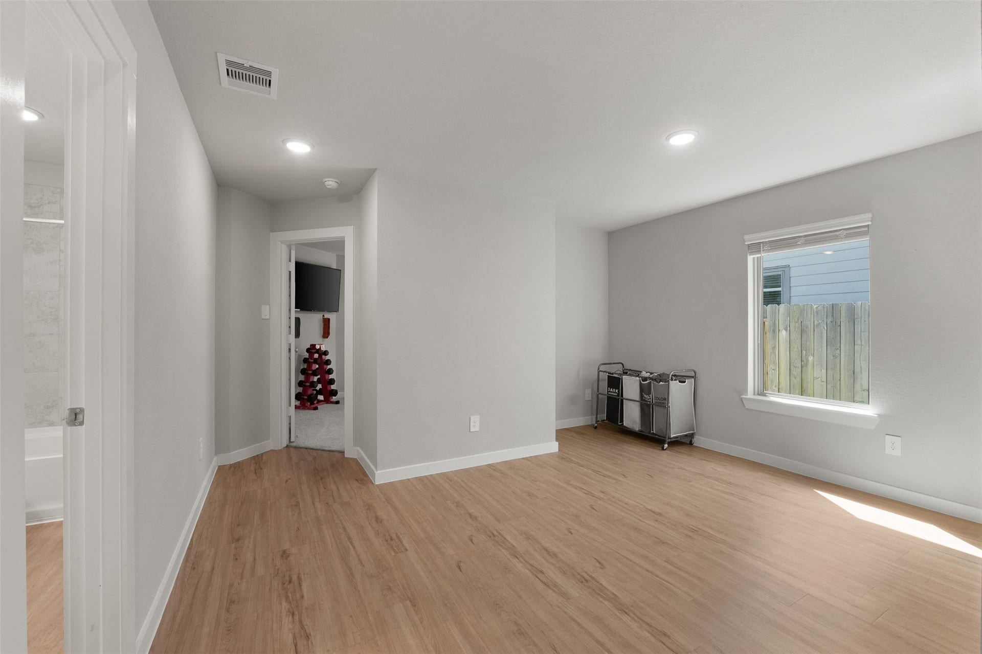 17707 Sapphire Pines Drive, New Caney, TX 77357 This open space could be used for a game room space/ formal dining the possibilities are endless