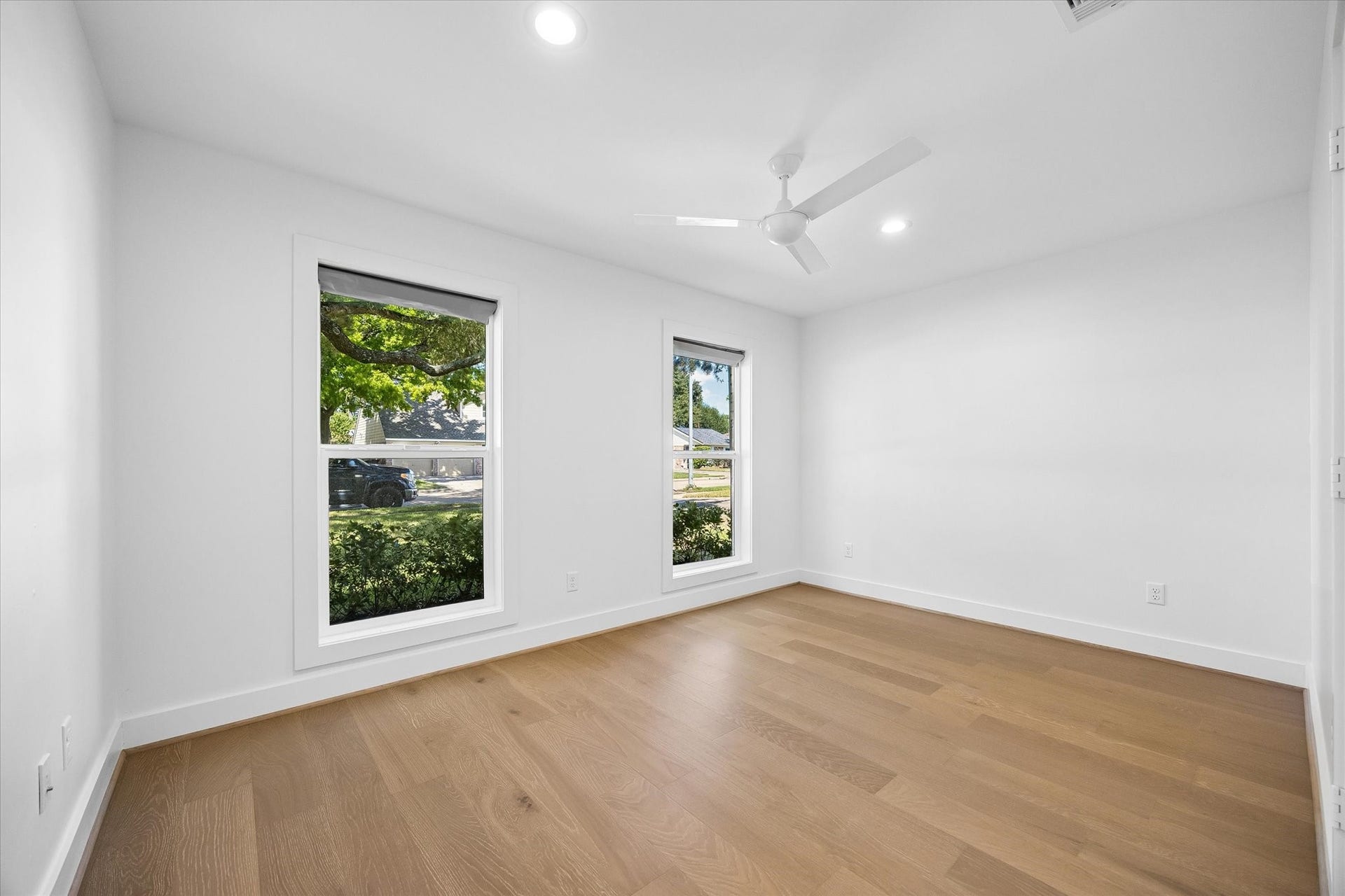 10659 Mayfield Road, Houston, TX 77043 This bedroom, located at the front of the property, offers large windows that let in plenty of natural light and create an inviting look at your low maintenance front yard. Its versatile layout can accommodate various design preferences, making it a comfortable retreat for family members or guests.