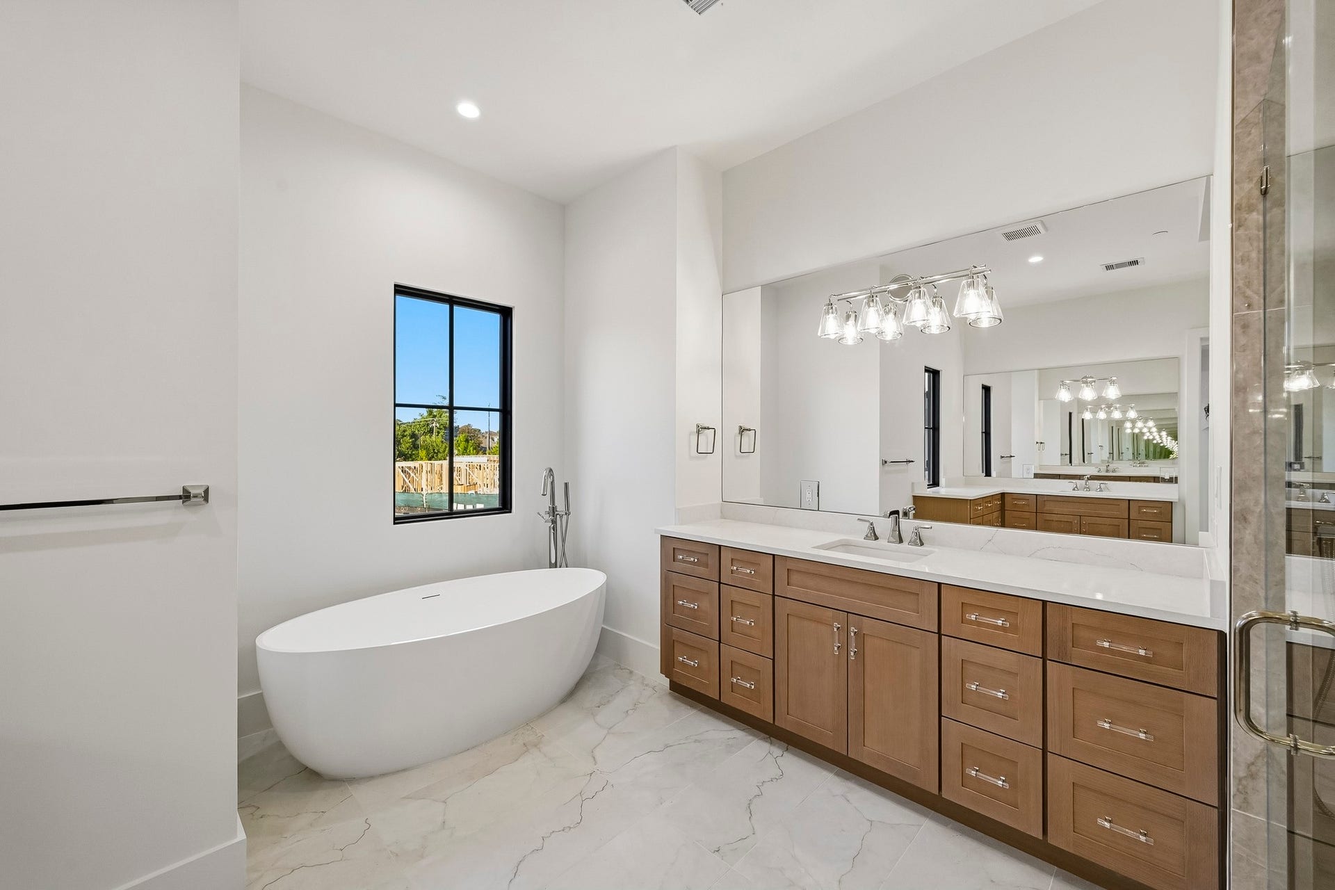 Double vanities, water closet, soaker tub, and massive walk-in shower!