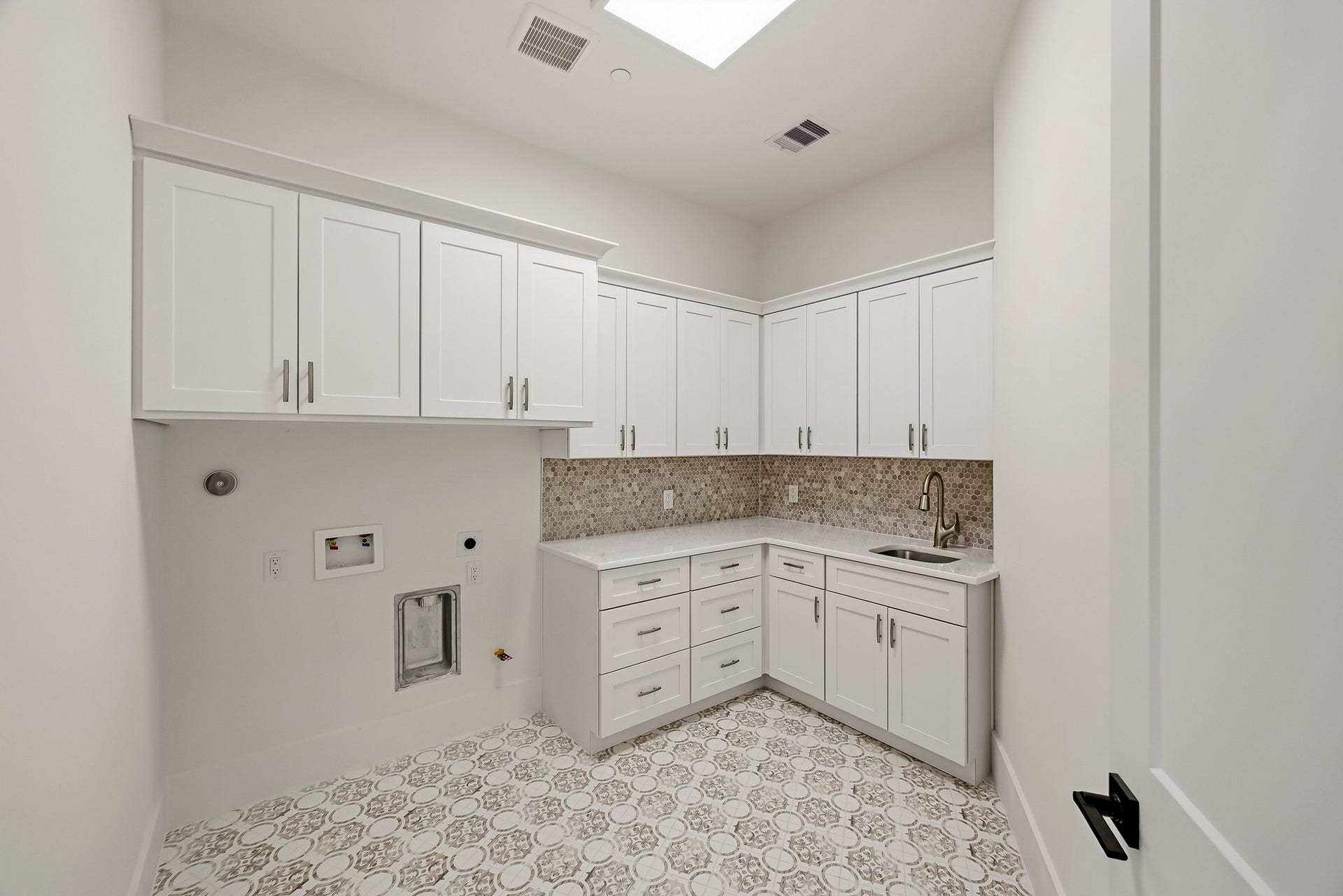 This gorgeous utility room is tucked between the bedrooms!