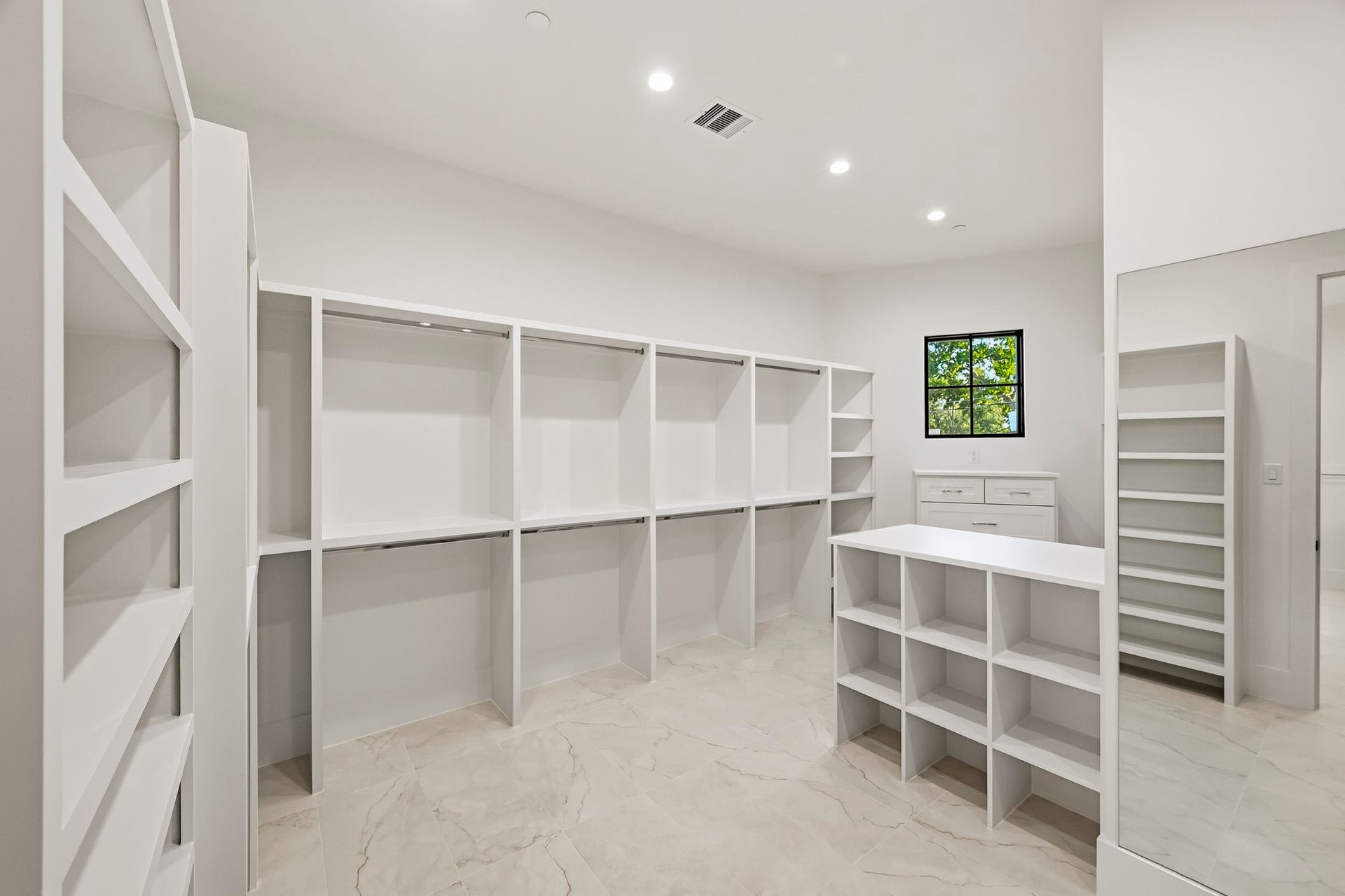 Your walk-in closet provides tons of built-ins and natural light!
