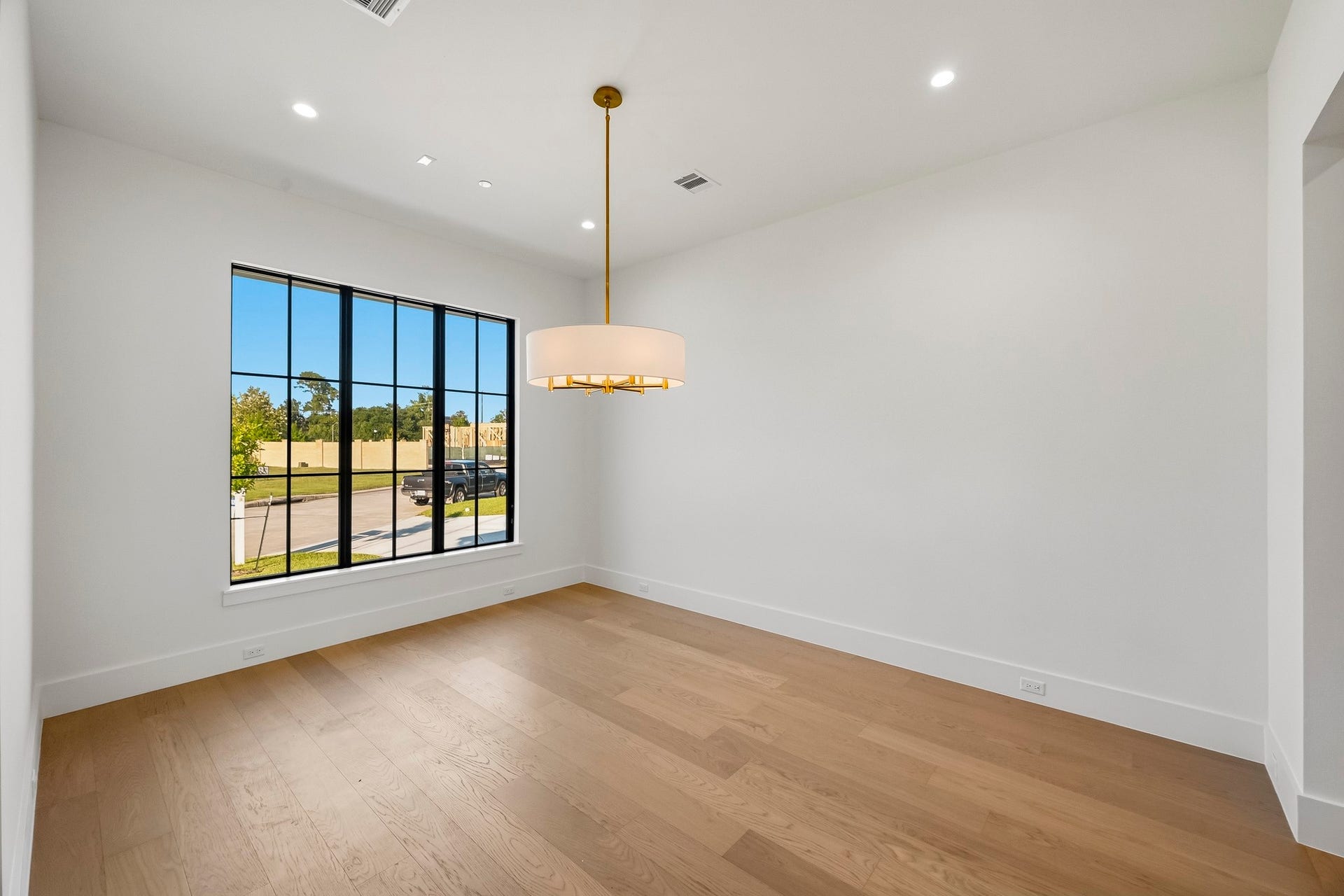 The formal dining offers a commanding view of the front lawn!