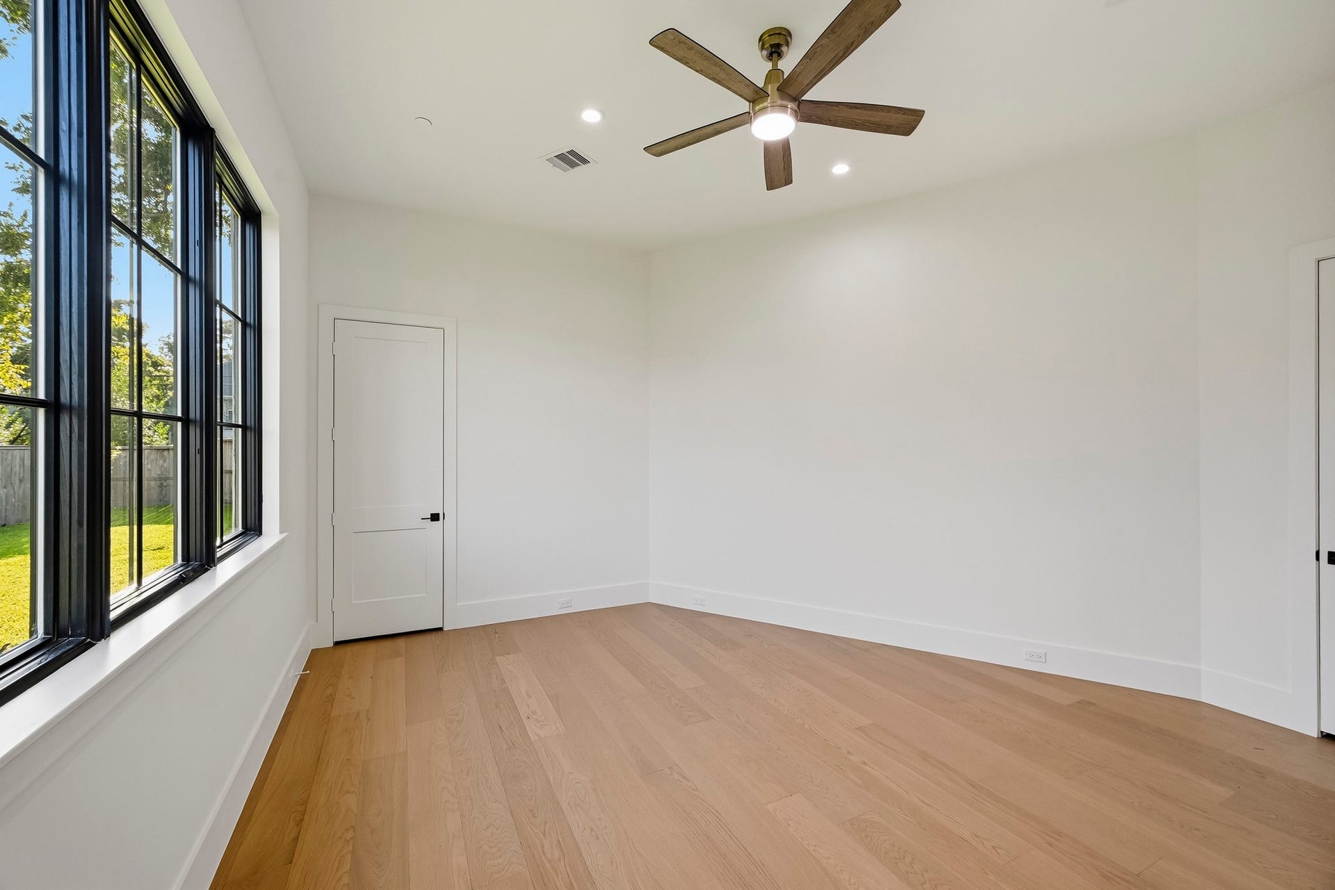 The ground floor guest suite offers a walk-in closet and a view of the backyard!