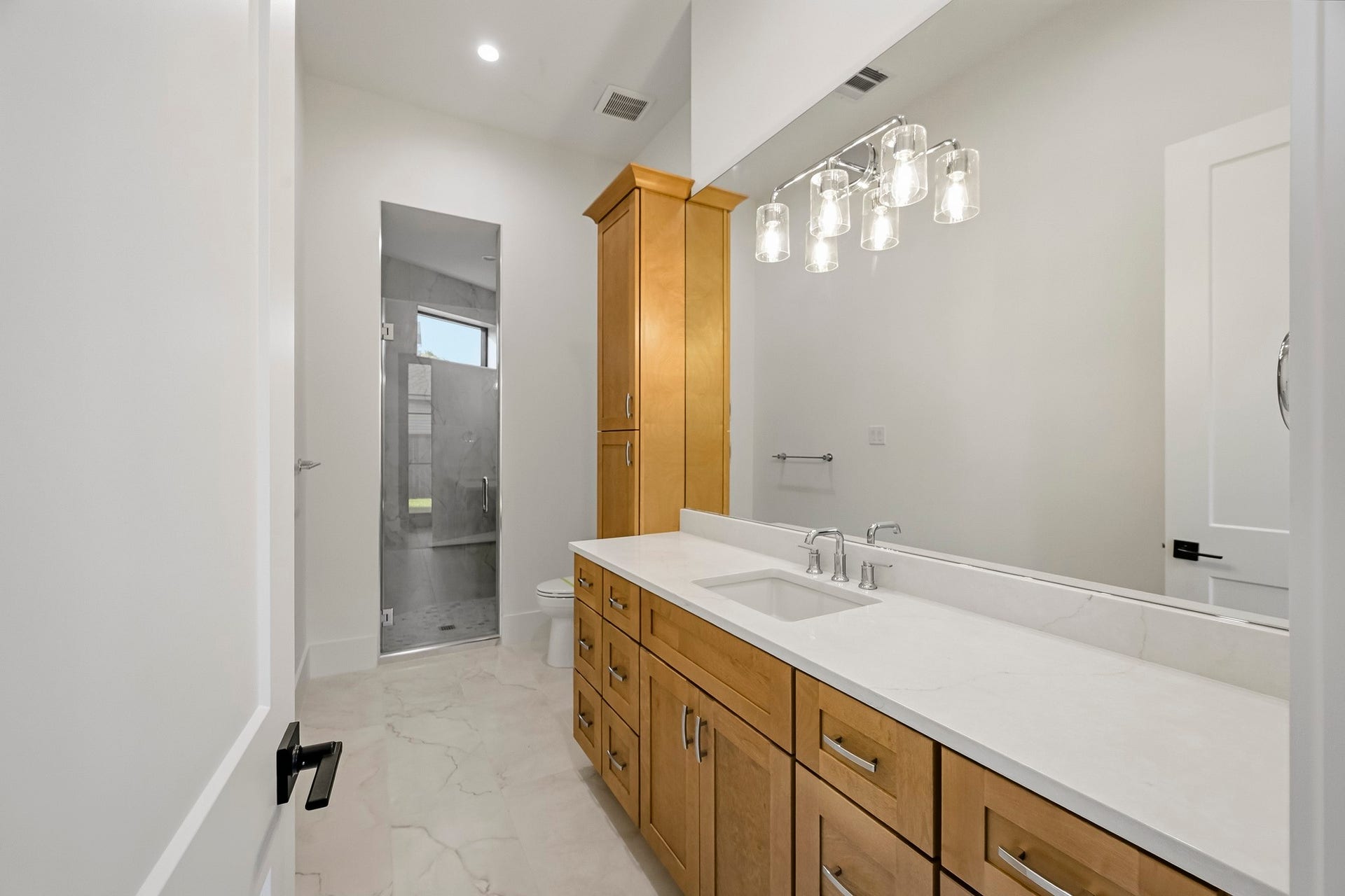 Tucked behind the fireplace is a beautiful downstairs full bath!