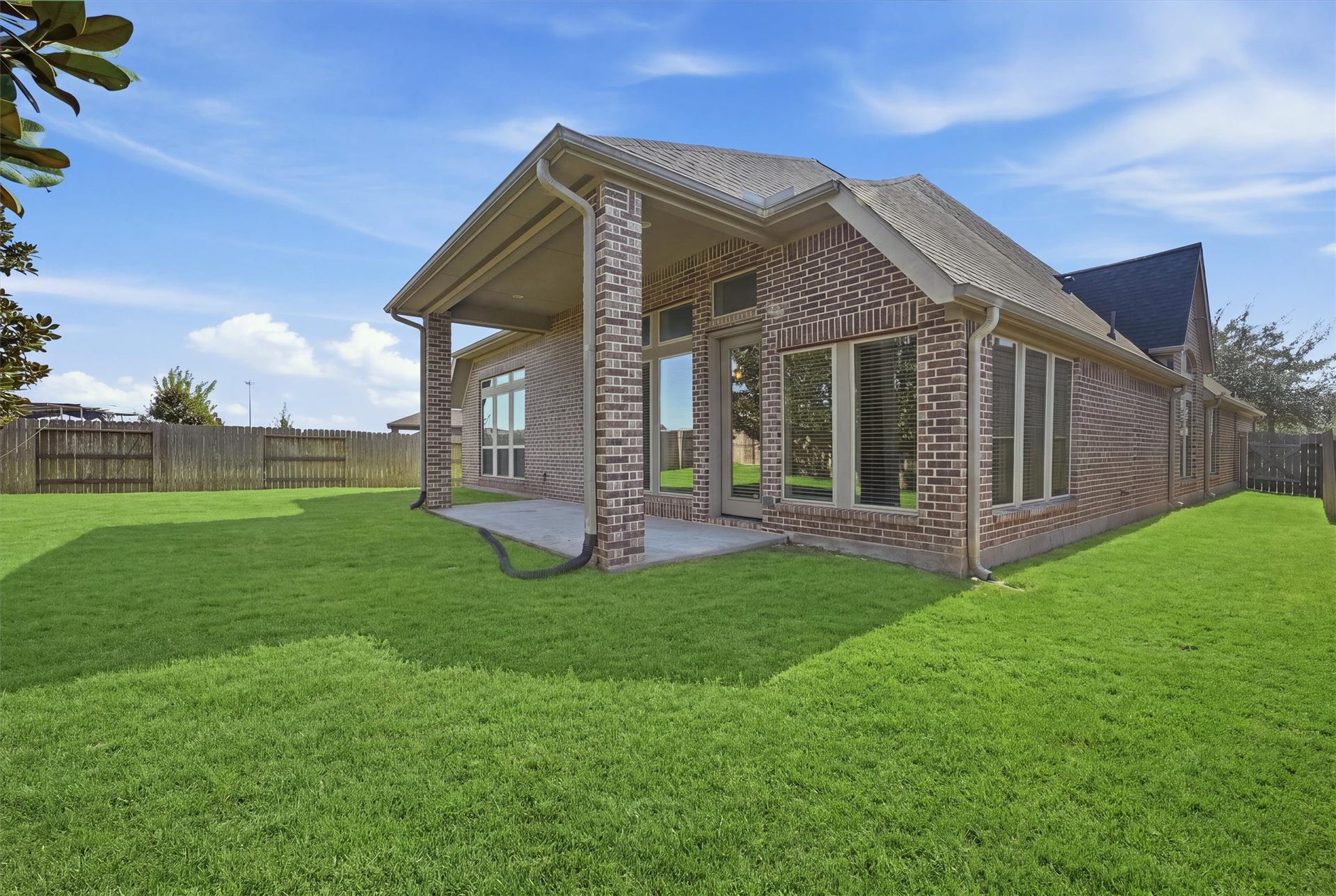 Large fenced backyard offers plenty of room for outdoor activities
