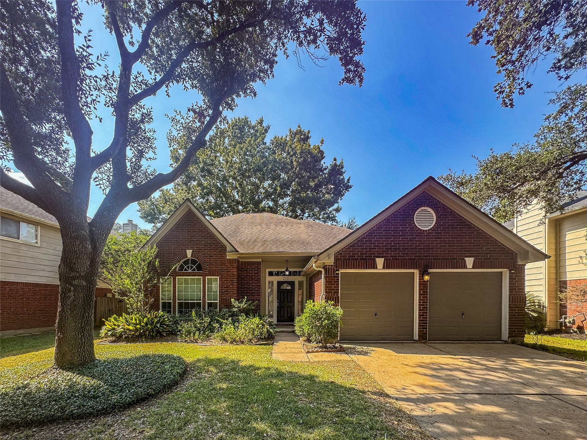210 Rolling Plains Drive, Sugar Land, TX 77479 nice landscaped, 2-story, elegant brick home