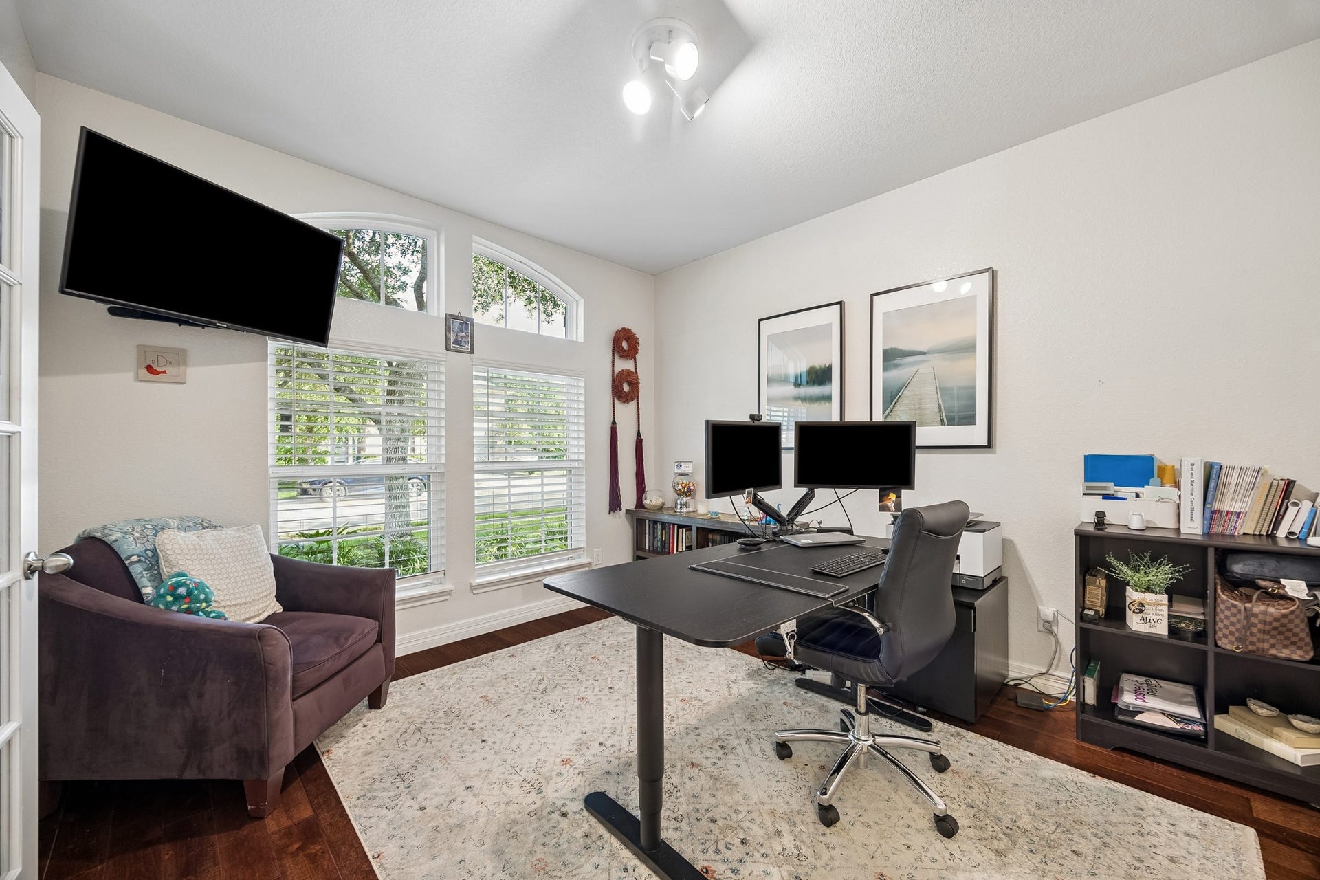 3102 London Lane, Missouri City, TX 77459 Located immediately next to the entryway, the office provides a quiet, private space for conducting business while enjoying the lush green view.