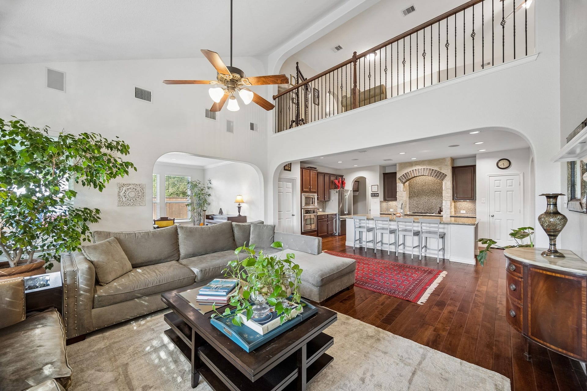 3102 London Lane, Missouri City, TX 77459 The living and kitchen space anchor the home, providing entertaining spaces for large gatherings. Note the casual dining area situated in the left of this picture.