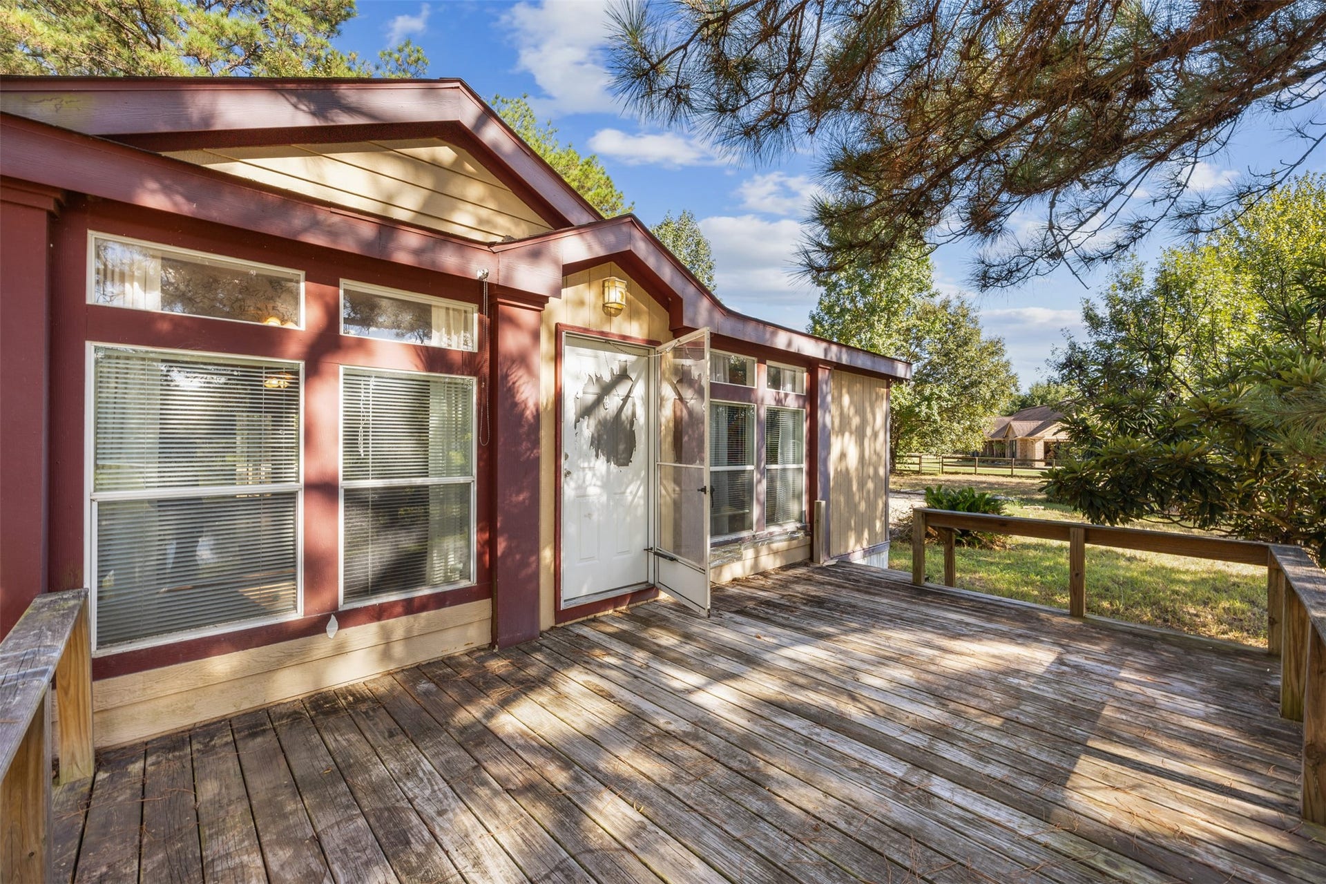 9944 Chestnut Court, Montgomery, TX 77316 The spacious wooden deck offers an inviting outdoor space with room for seating, entertaining, or simply enjoying the peaceful, tree-lined surroundings.