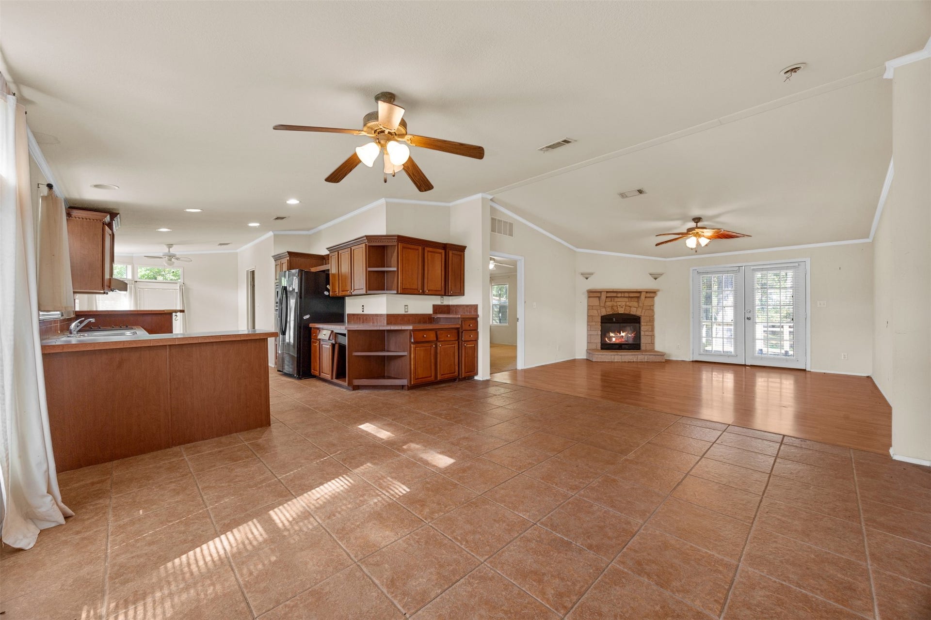9944 Chestnut Court, Montgomery, TX 77316 This open-concept layout seamlessly connects the kitchen, dining, and living areas, creating a spacious setting for everyday living and entertaining. Large windows bring in natural light, while the flexible floor plan offers plenty of possibilities for personalization.