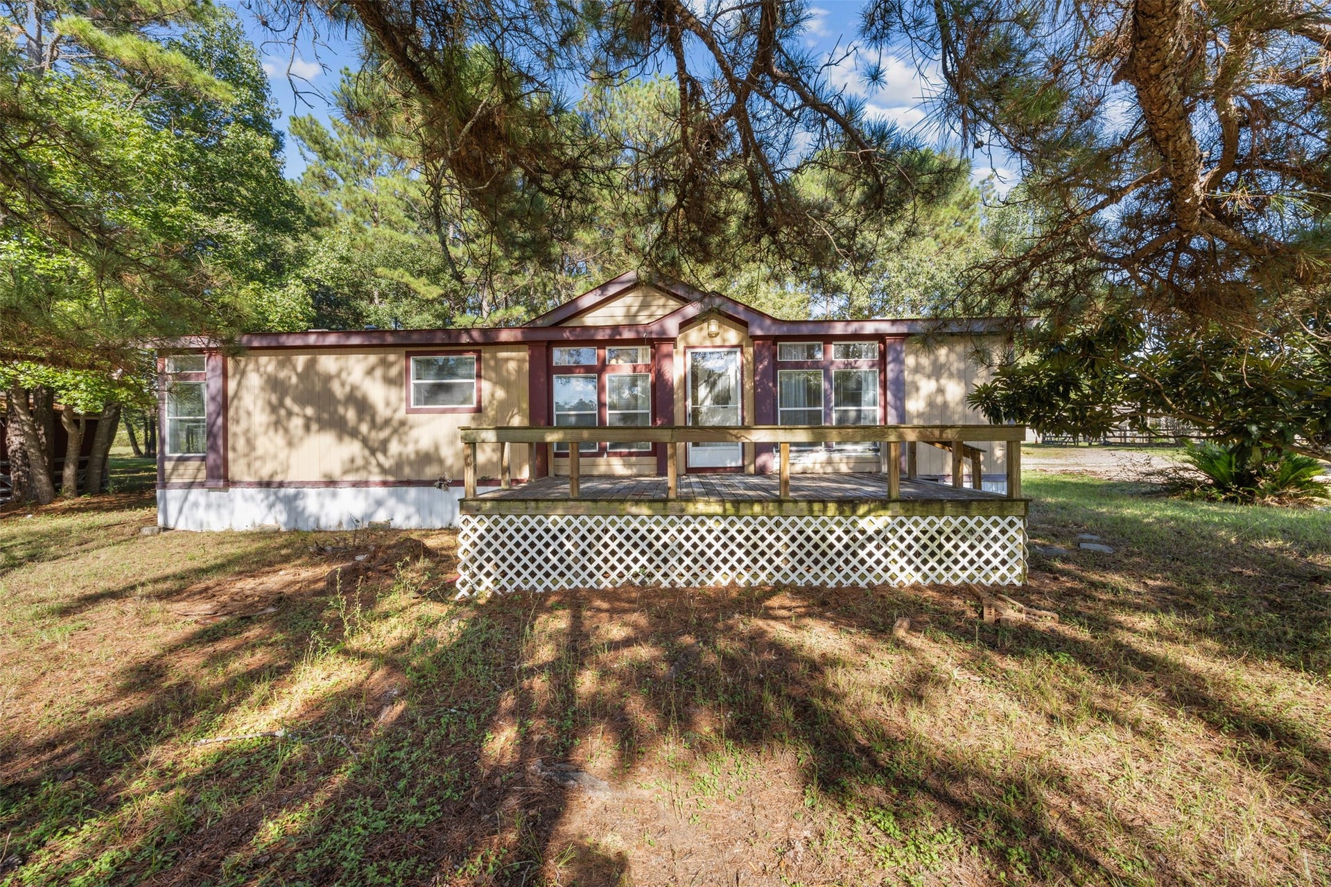 9944 Chestnut Court, Montgomery, TX 77316 Nestled among mature trees on 2.8 acres in the desirable Stone Ranch community, this charming home welcomes you with a spacious front deck, peaceful surroundings, and endless possibilities to make it your own.