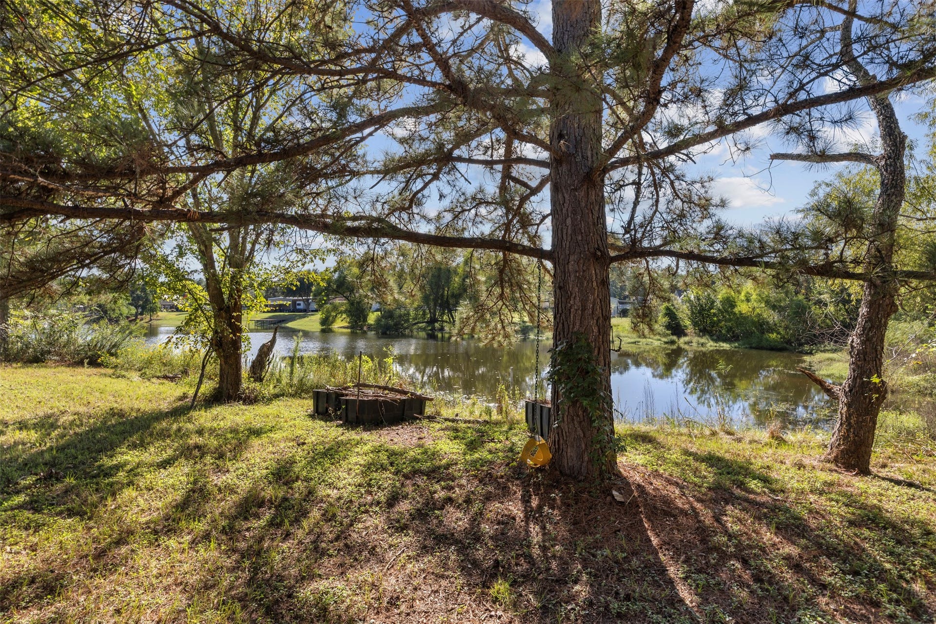 9944 Chestnut Court, Montgomery, TX 77316 Mature trees provide a beautiful natural canopy over the backyard, creating a peaceful setting to relax and enjoy scenic views of the shared pond.