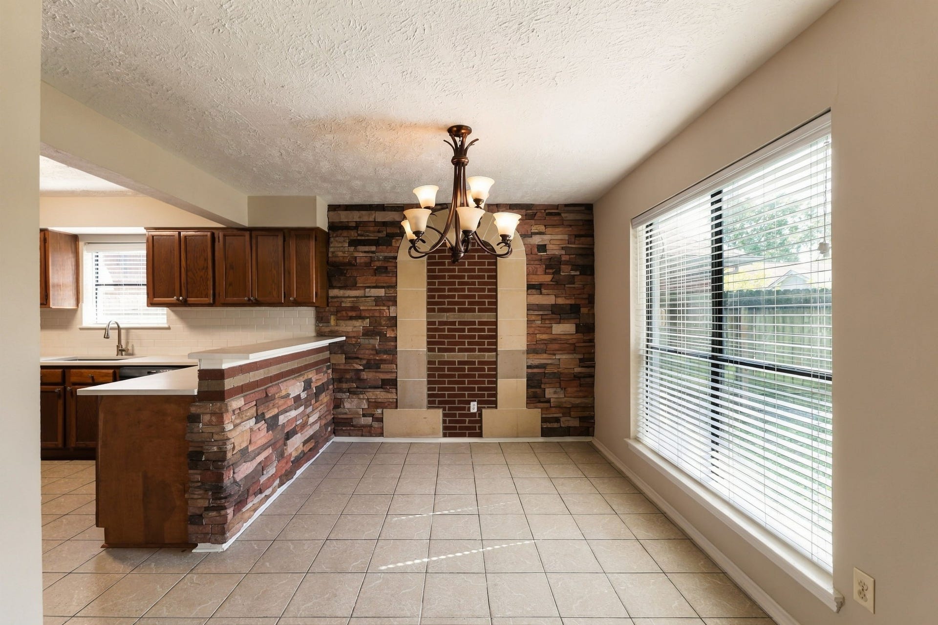The dining area with large window overlooking the backyard.