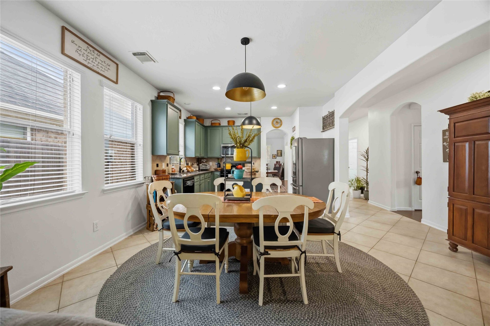 11415 English Rose Trail, Missouri City, TX 77459 Bright breakfast area featuring tile flooring, large windows, and convenient access to the kitchen.