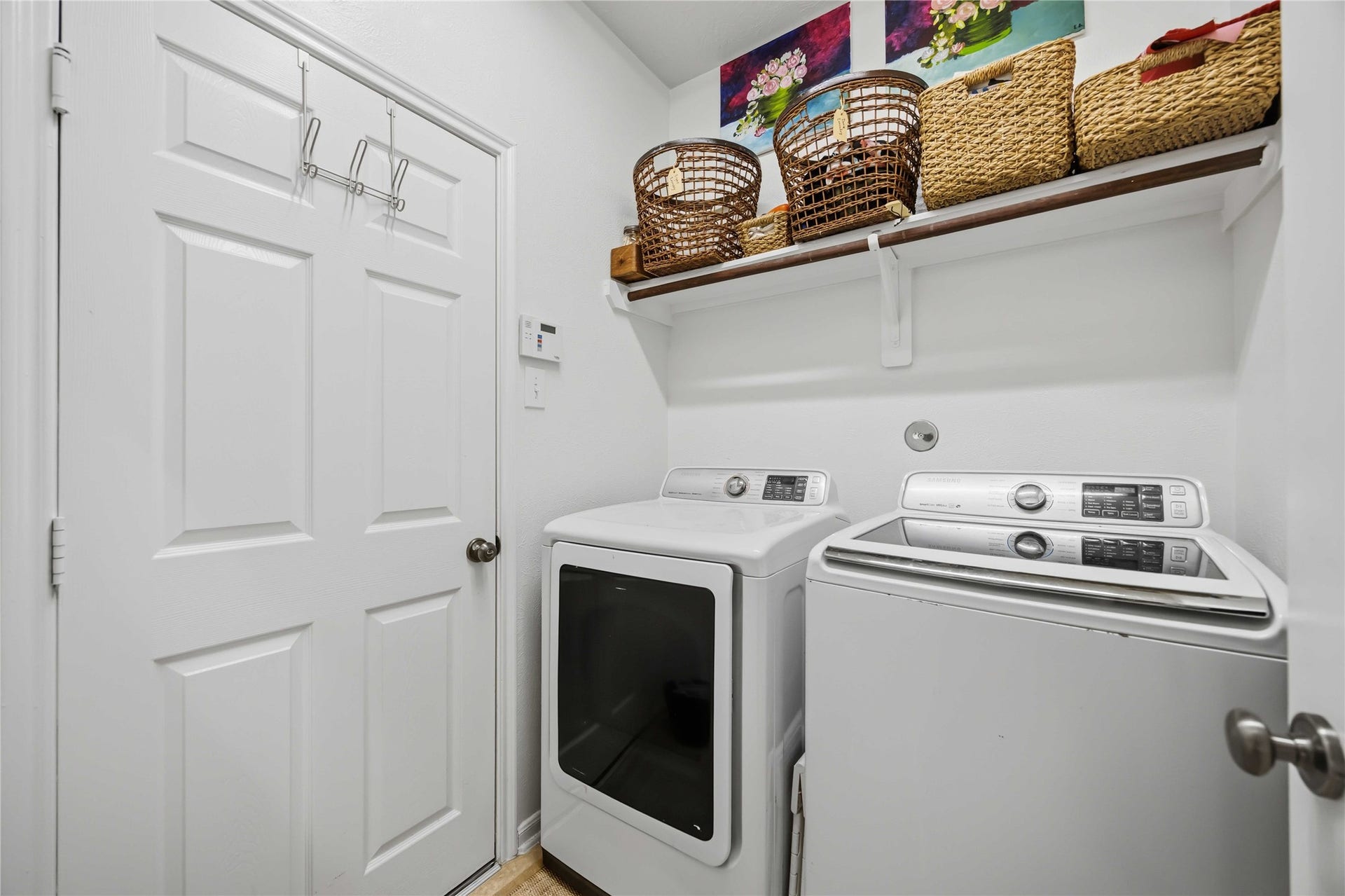 11415 English Rose Trail, Missouri City, TX 77459 Convenient laundry room with full-size washer and dryer space and overhead shelving for extra storage.