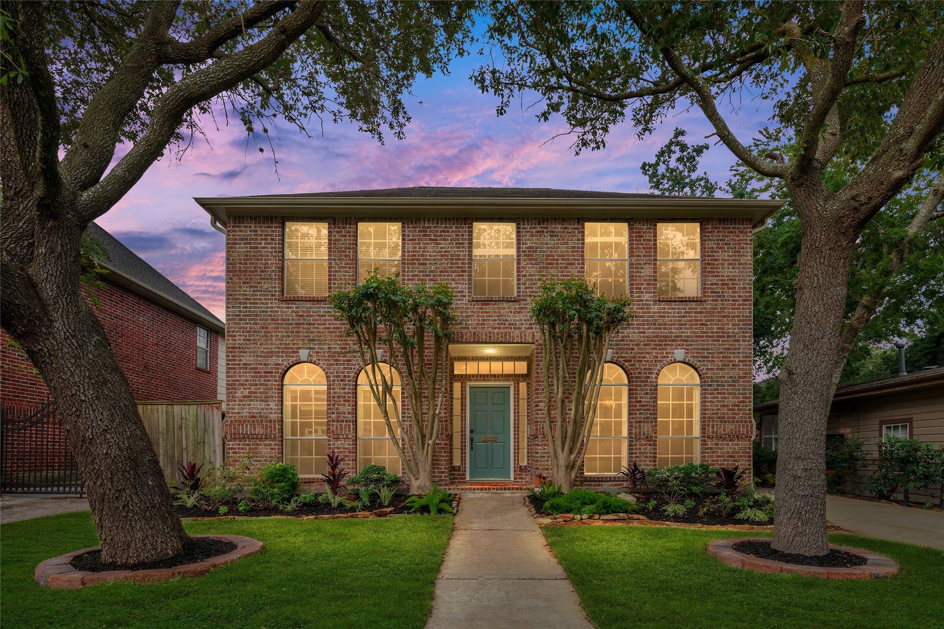 4312 Holt Street, Bellaire, TX 77401 Framed by majestic live oaks, this stately brick two-story makes an elegant first impression.