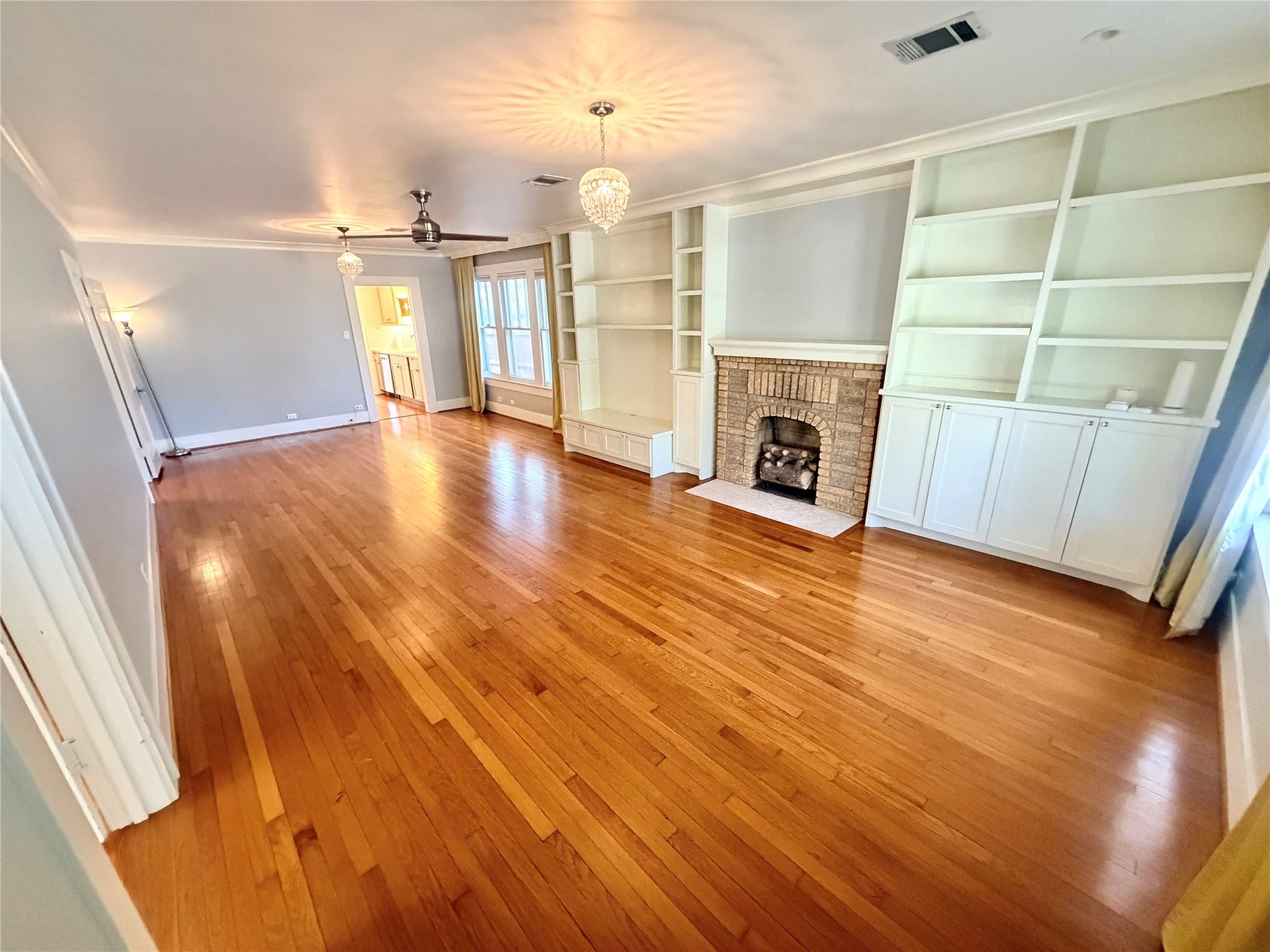 open living room as seen from the front door.  Lots of windows!