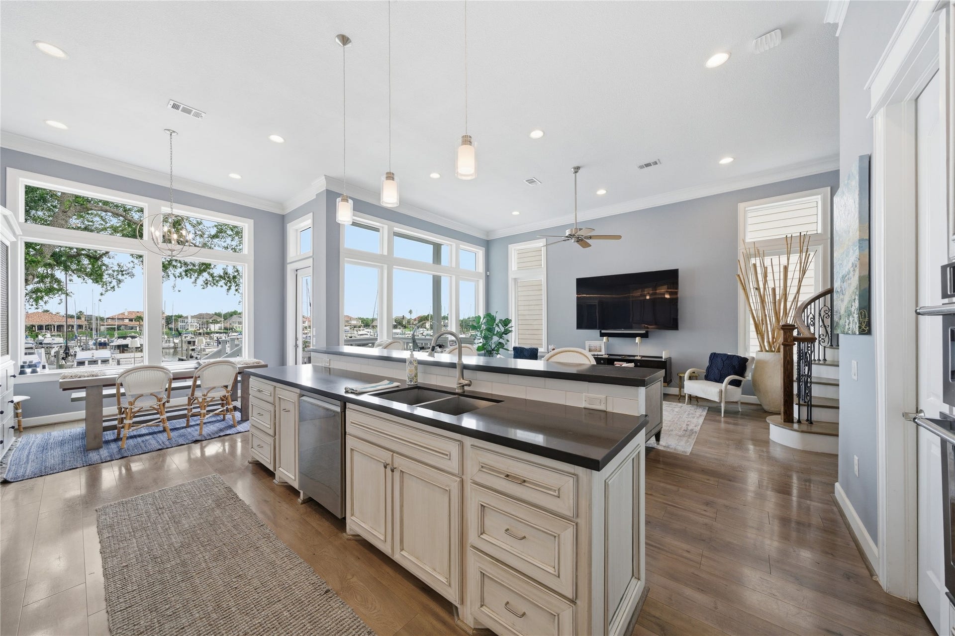 2174 Marina Way, Kemah, TX 77565 The open concept kitchen/family room has a wall of windows to enjoy the marina view.