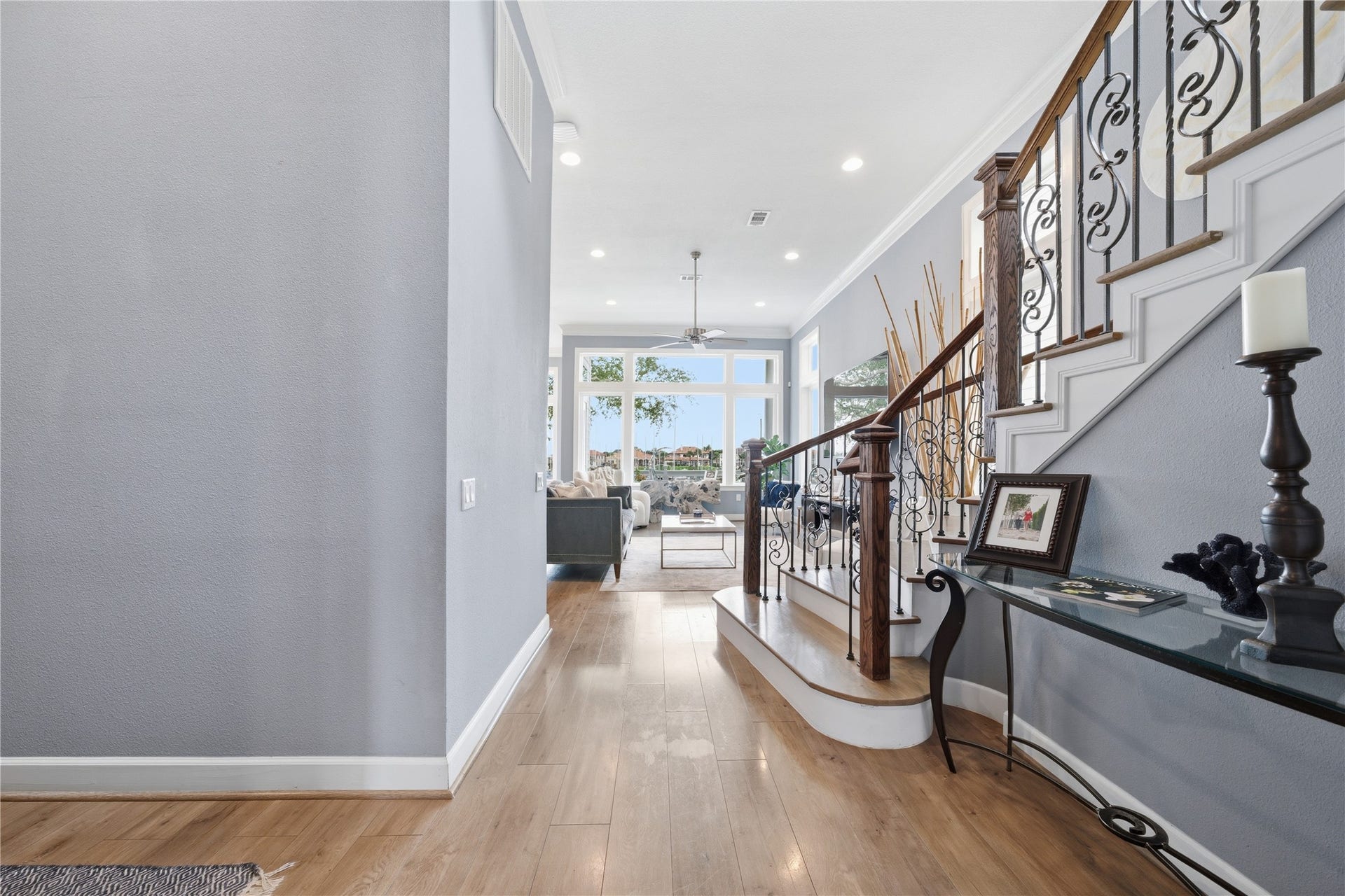 2174 Marina Way, Kemah, TX 77565 As you head towards the back of the house, you'll pass the beautiful curved staircase before reaching the family room and kitchen.