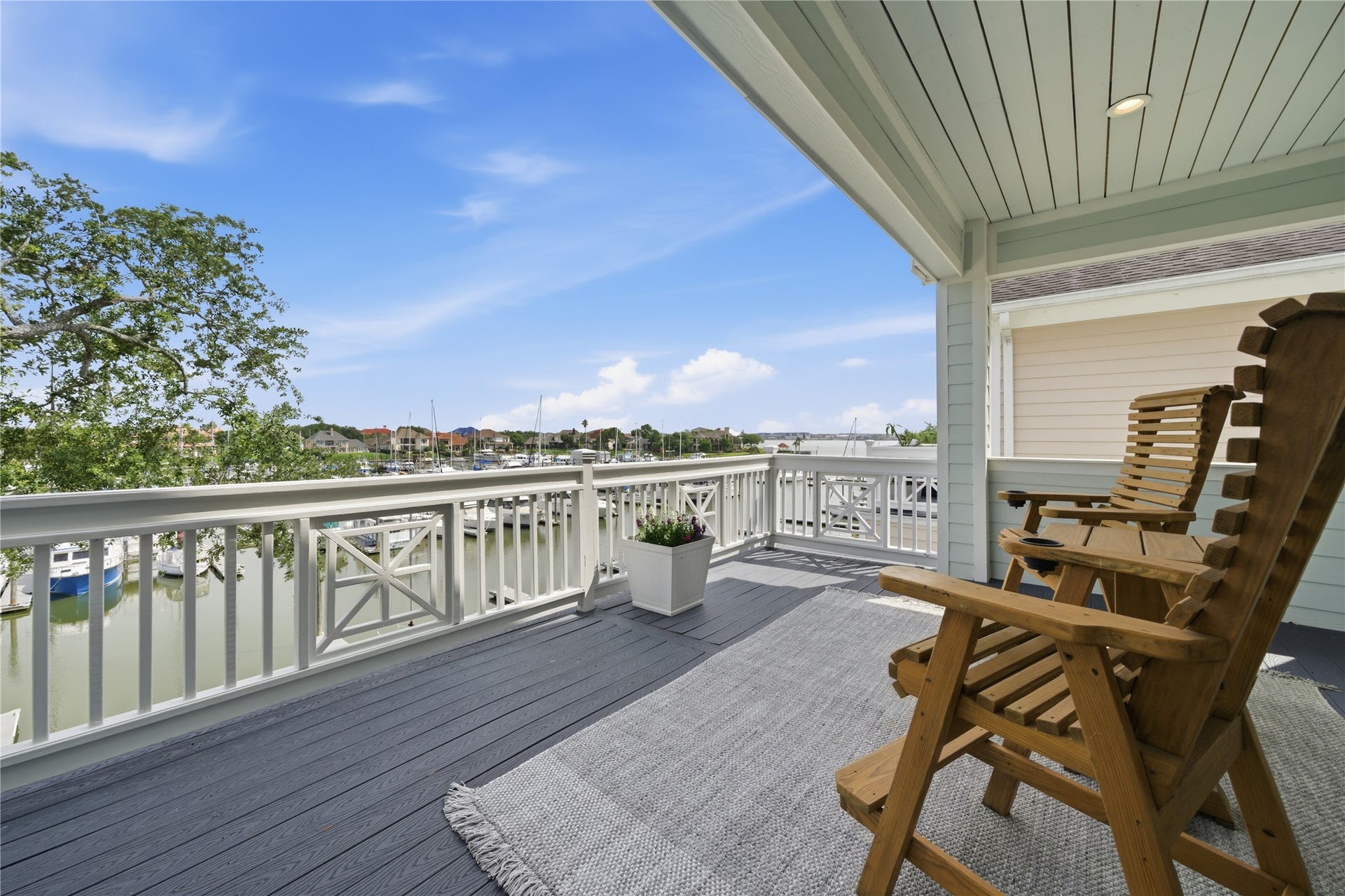 2174 Marina Way, Kemah, TX 77565 Morning coffee with a lake view on the private balcony off of the primary bedroom.