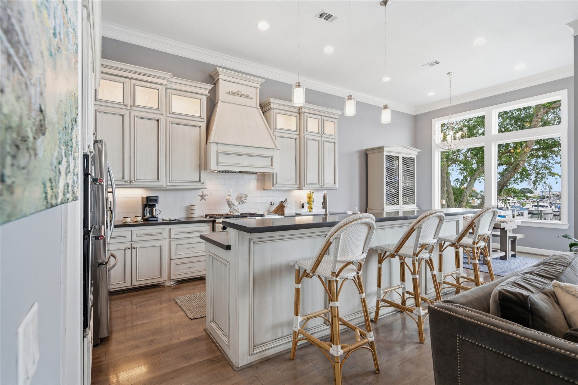 2174 Marina Way, Kemah, TX 77565 The kitchen is open to the family room, complete with bar seating and under-cabinet lighting.