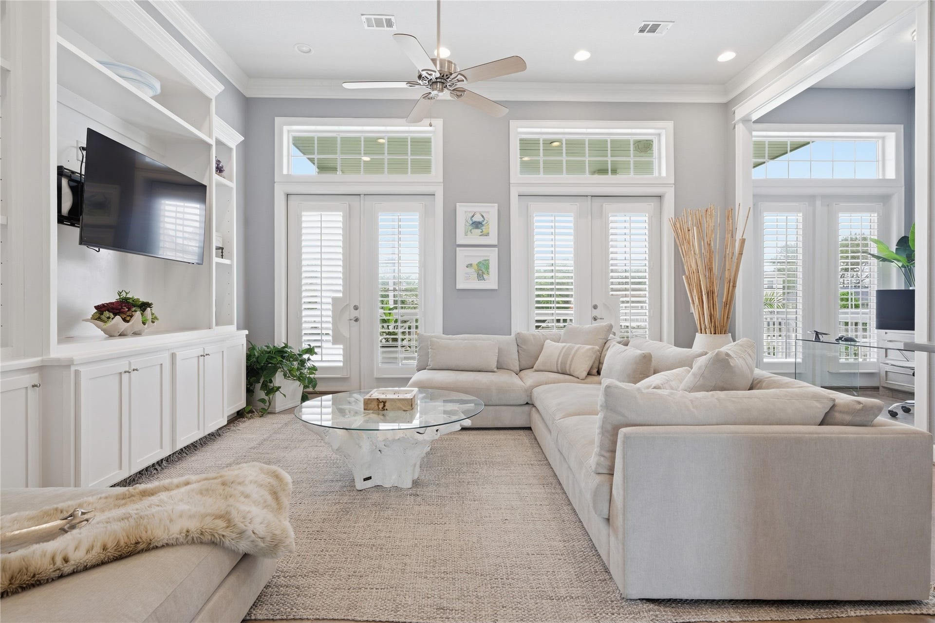 2174 Marina Way, Kemah, TX 77565 At the front of the house is this flex space that could be a second living area, a game room, or convert it to a 4th bedroom. Two sets of french doors access the front balcony. Notice the built-in along the left wall.