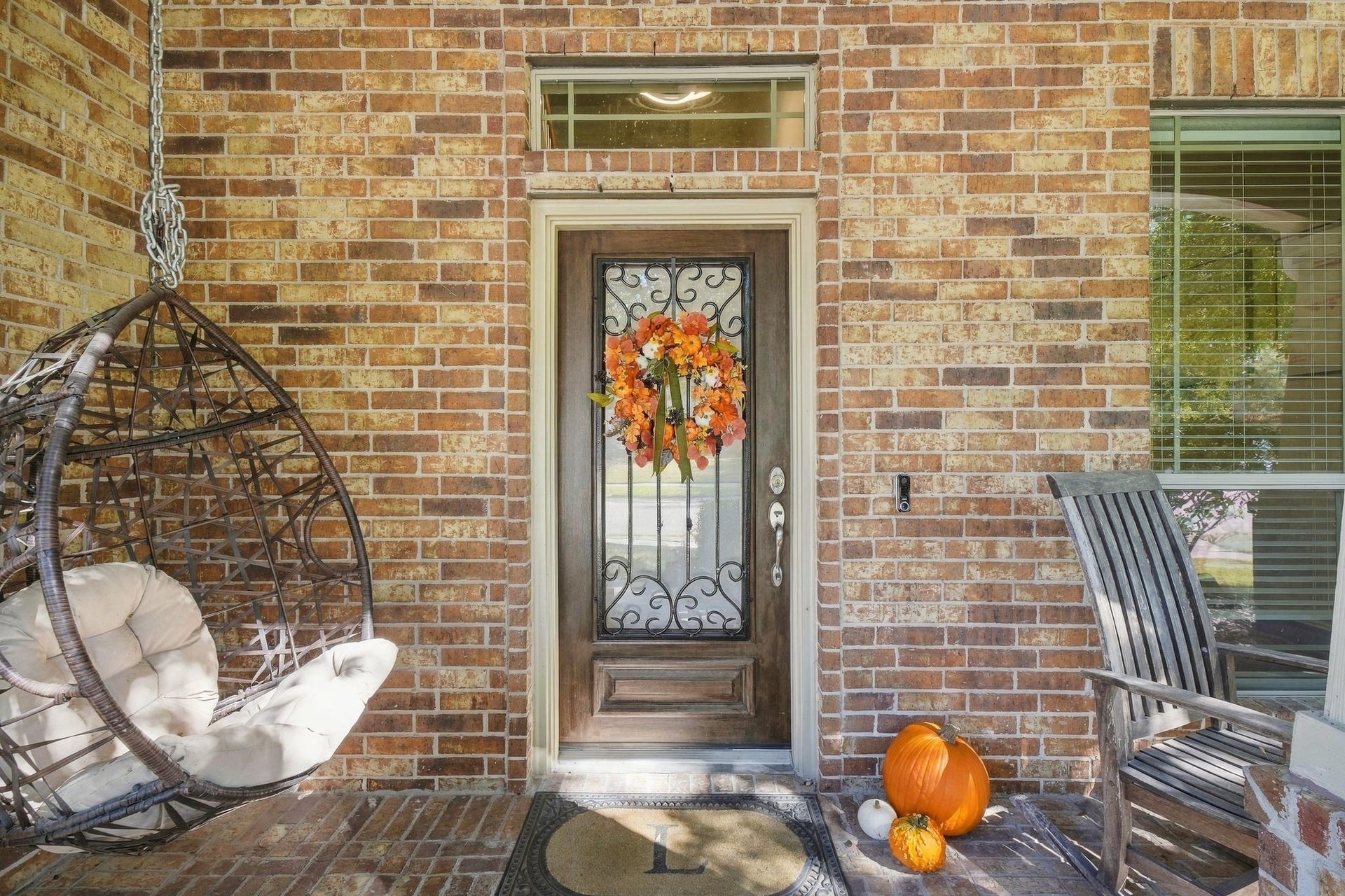 26037 Kings Mill Crest Drive, Kingwood, TX 77339 Charming front porch with a brick exterior, featuring a decorative door for a welcoming atmosphere.