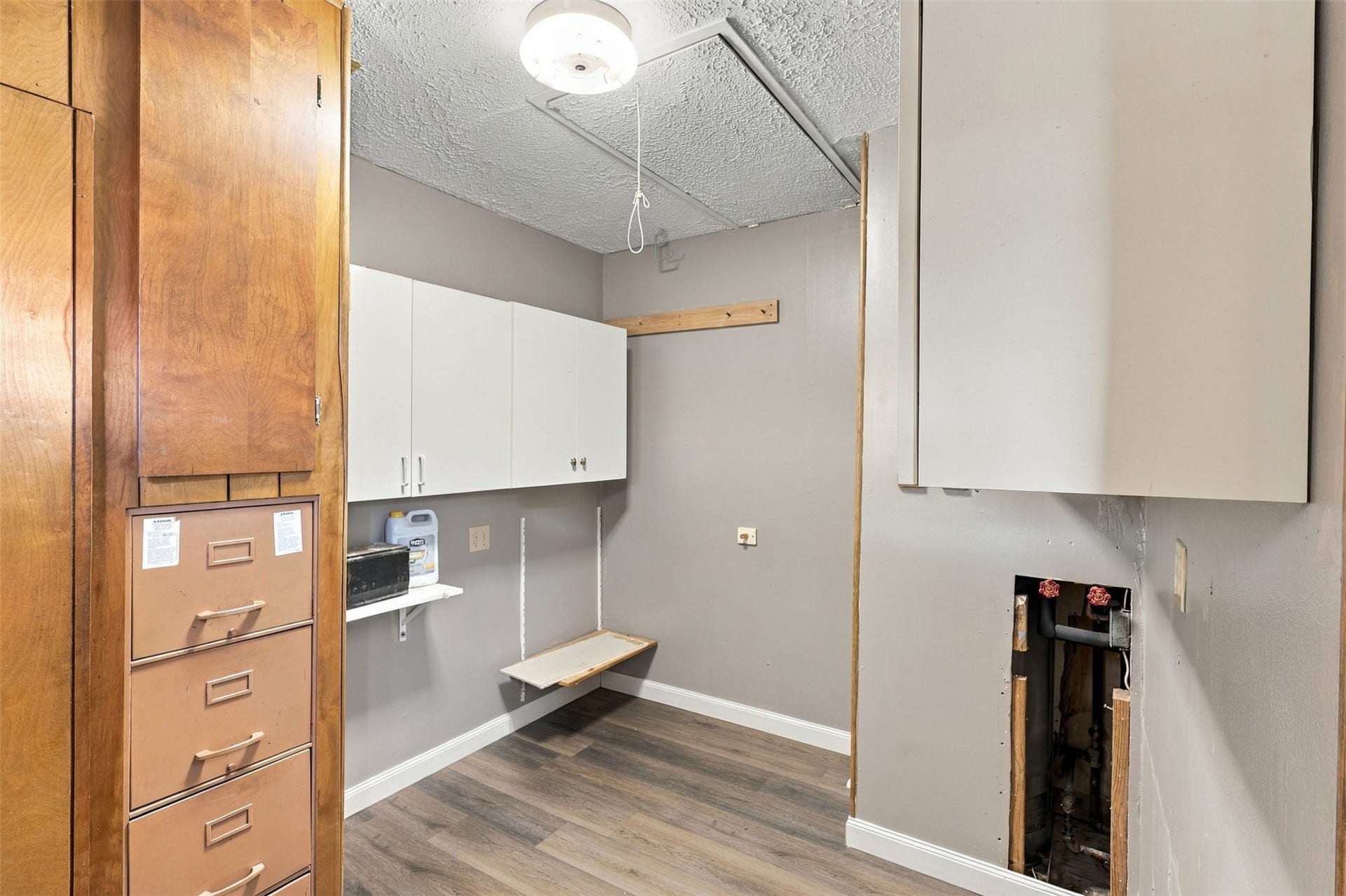 8421 Baker Drive, Houston, TX 77017 Dedicated utility area for laundry and household needs