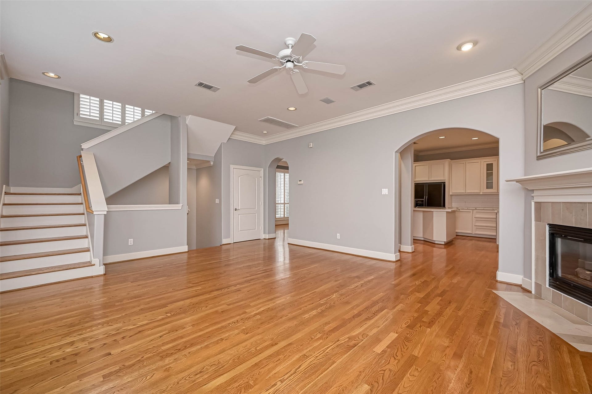 6413 Westcott Street, Houston, TX 77007 The living room is attached to the kitchen and formal dining. Door by the stairs is to a massive storage closet.