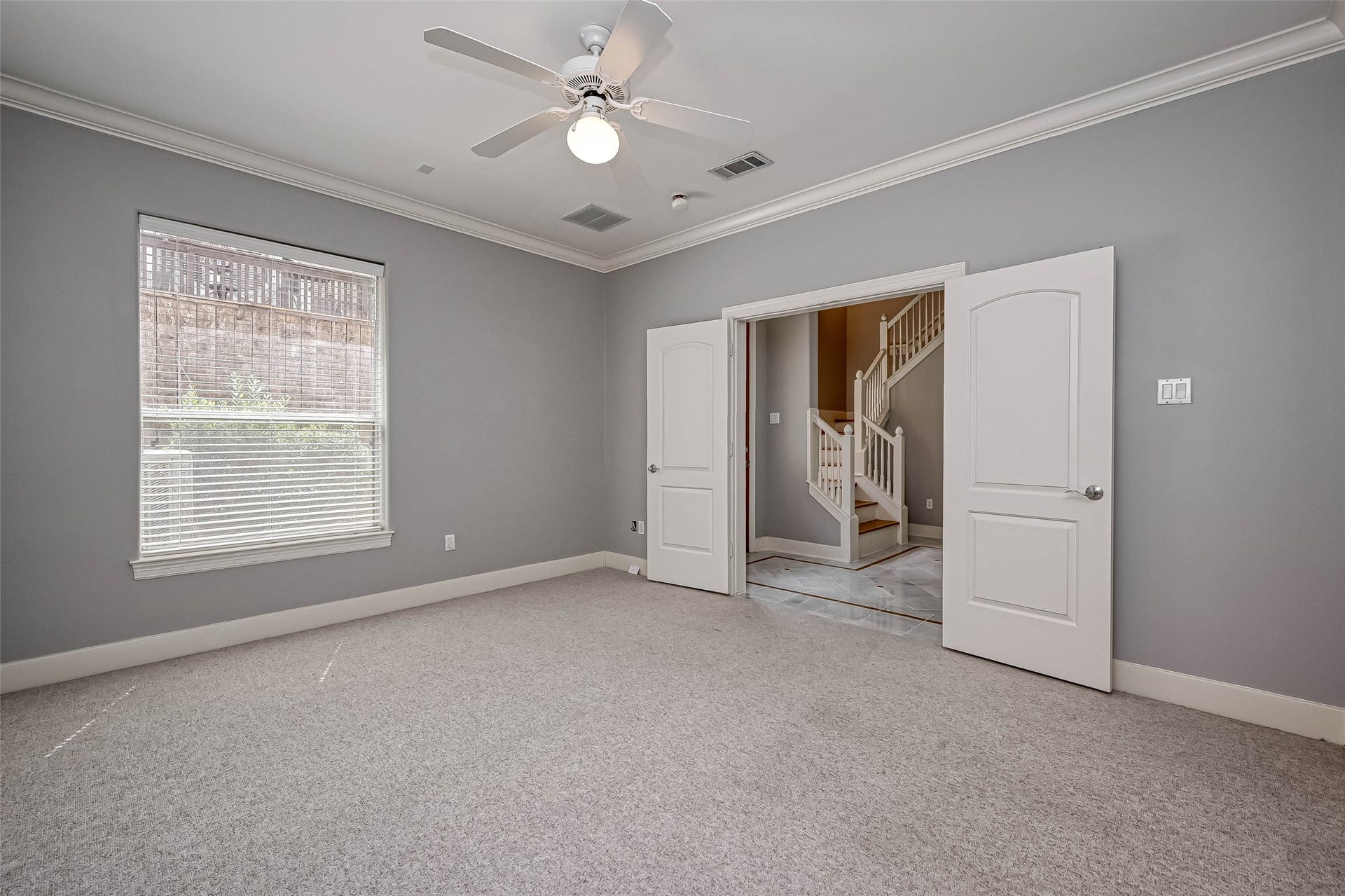 6413 Westcott Street, Houston, TX 77007 First floor secondary bedroom with french doors and en suite bath