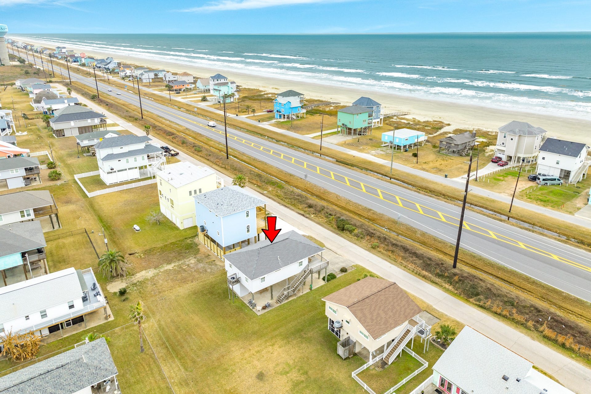 23012 Verano Drive, Galveston, TX 77554 Aerial view of home & beach looking to the SE.
