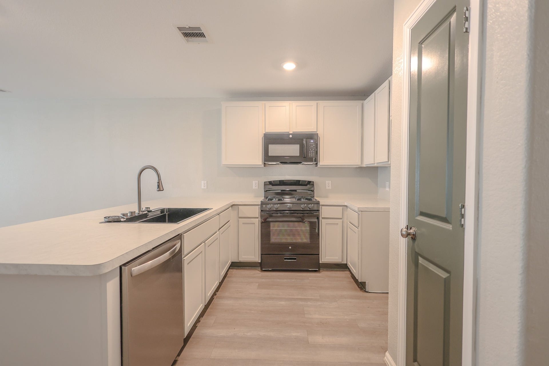 Kitchen with new range and microwave