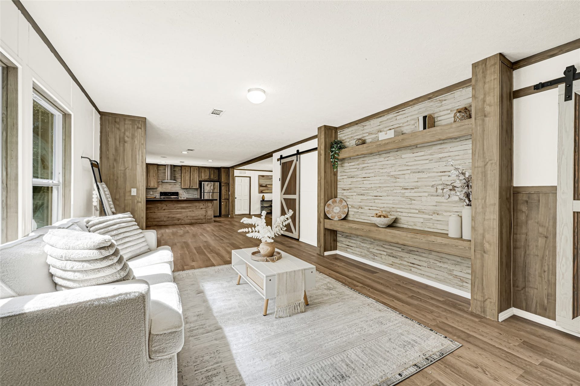 10506 Settlers Crossing, Conroe, TX 77303 Bright and inviting open-concept living space with a cozy seating area, stylish wood accents.