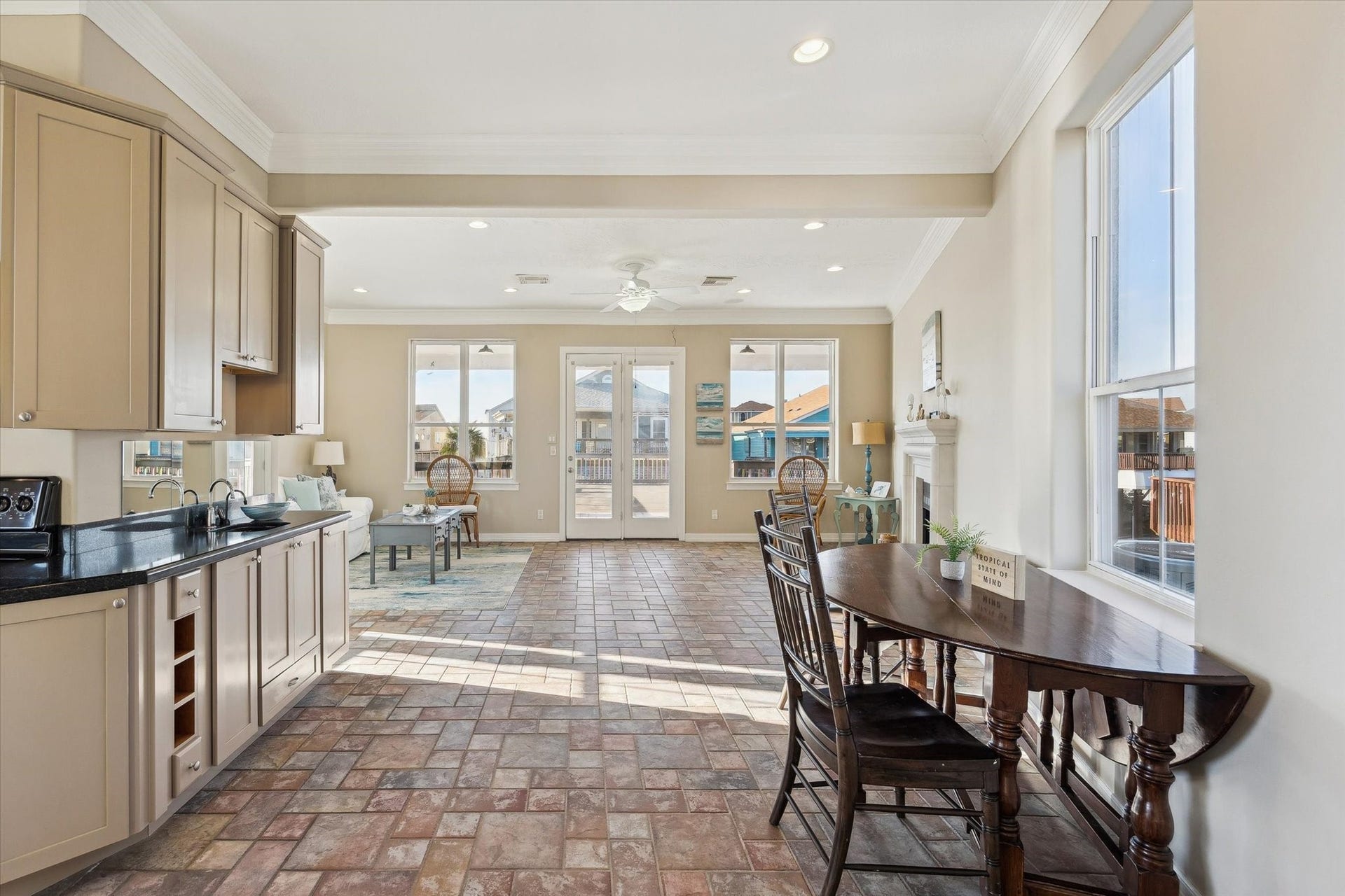 Kitchen to dining to family room and onto entertaining patio