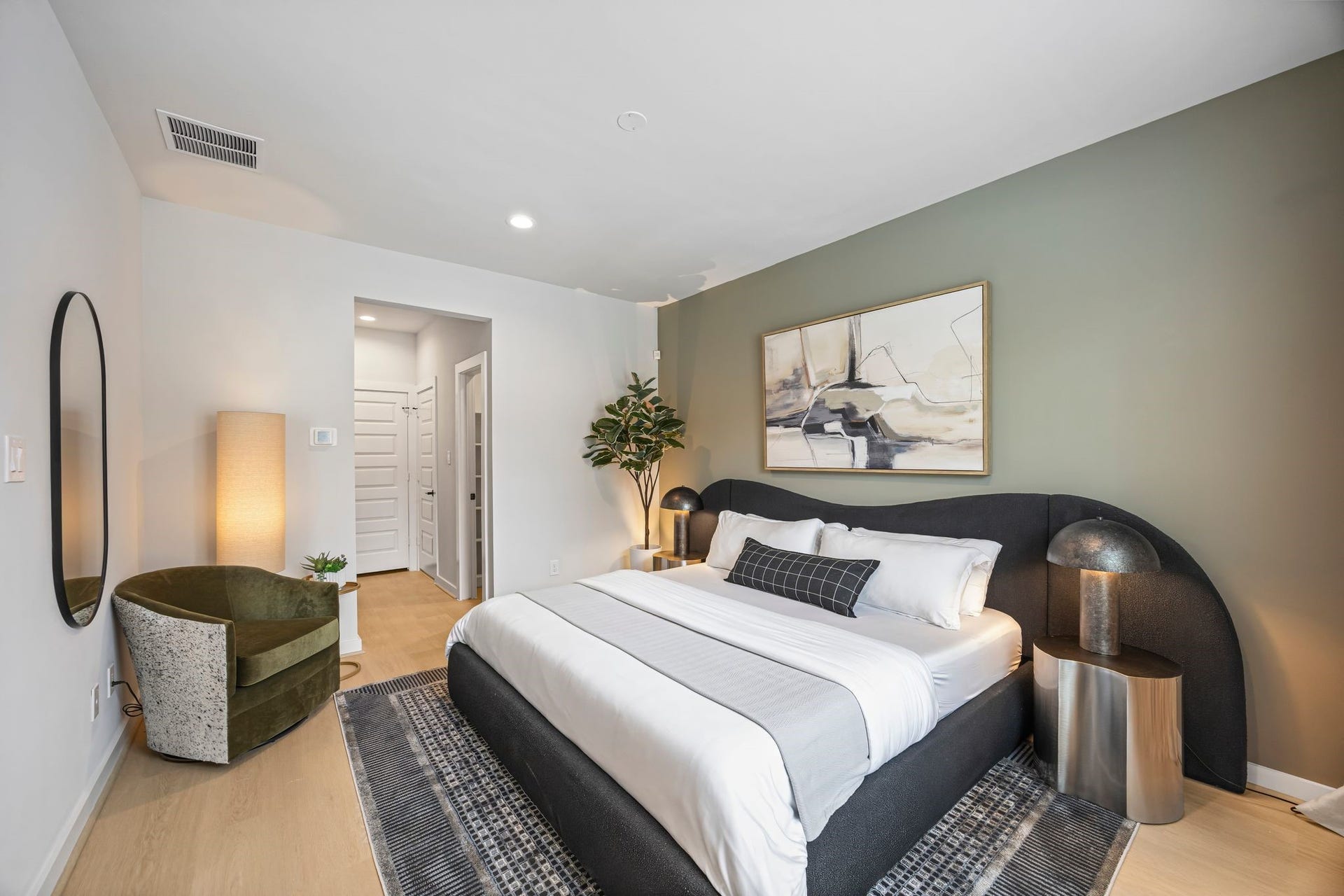 Experience tranquility in this beautifully appointed guest suite, featuring a cozy ambiance, modern decor, and ample natural light for a welcoming retreat. **Model Home of similar layout & finishes.**