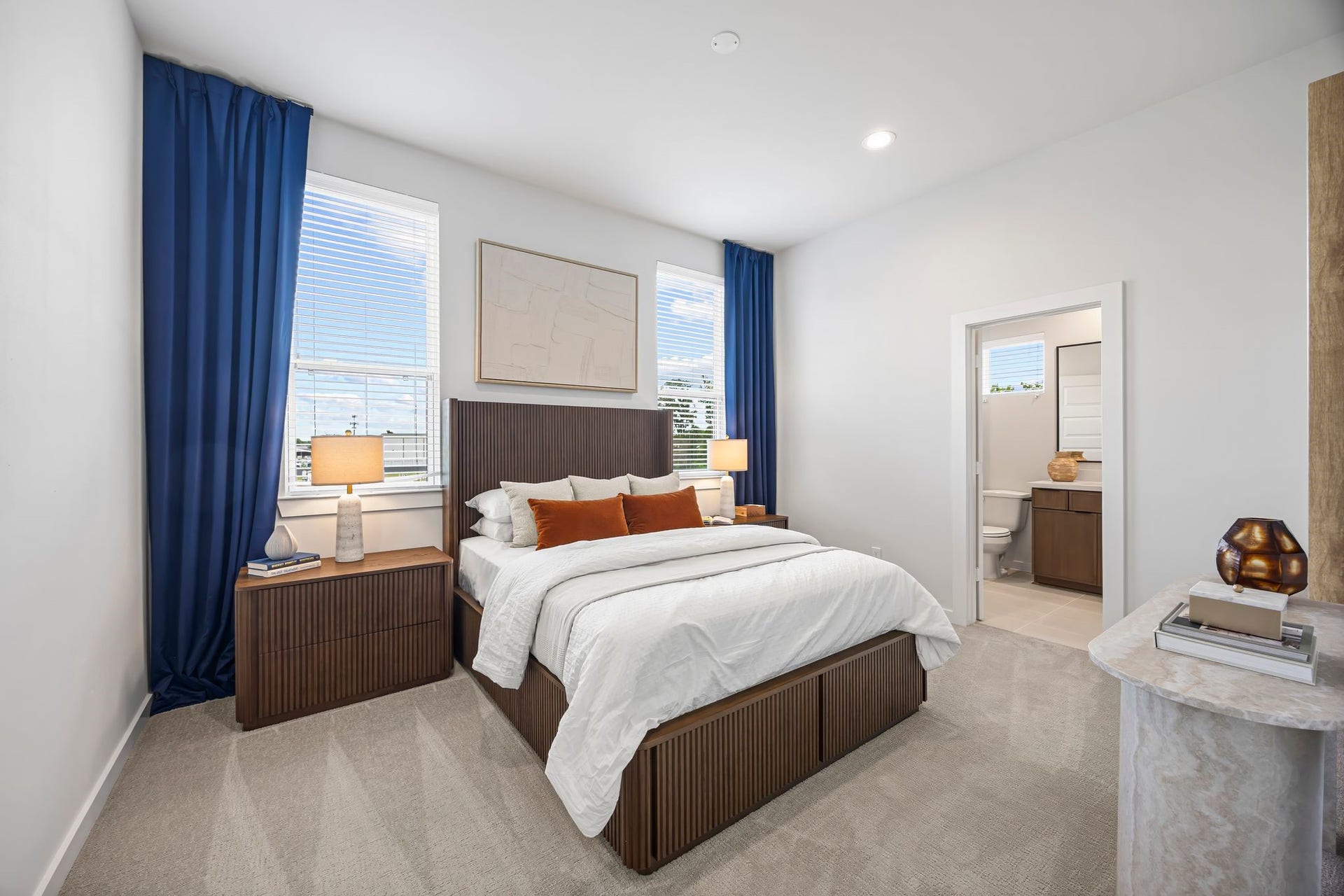 Elevate your living experience in this elegant third-floor bedroom, featuring abundant natural light, a cozy ambiance, and a convenient en-suite bathroom for ultimate comfort and privacy. **Model Home of similar layout & finishes.**