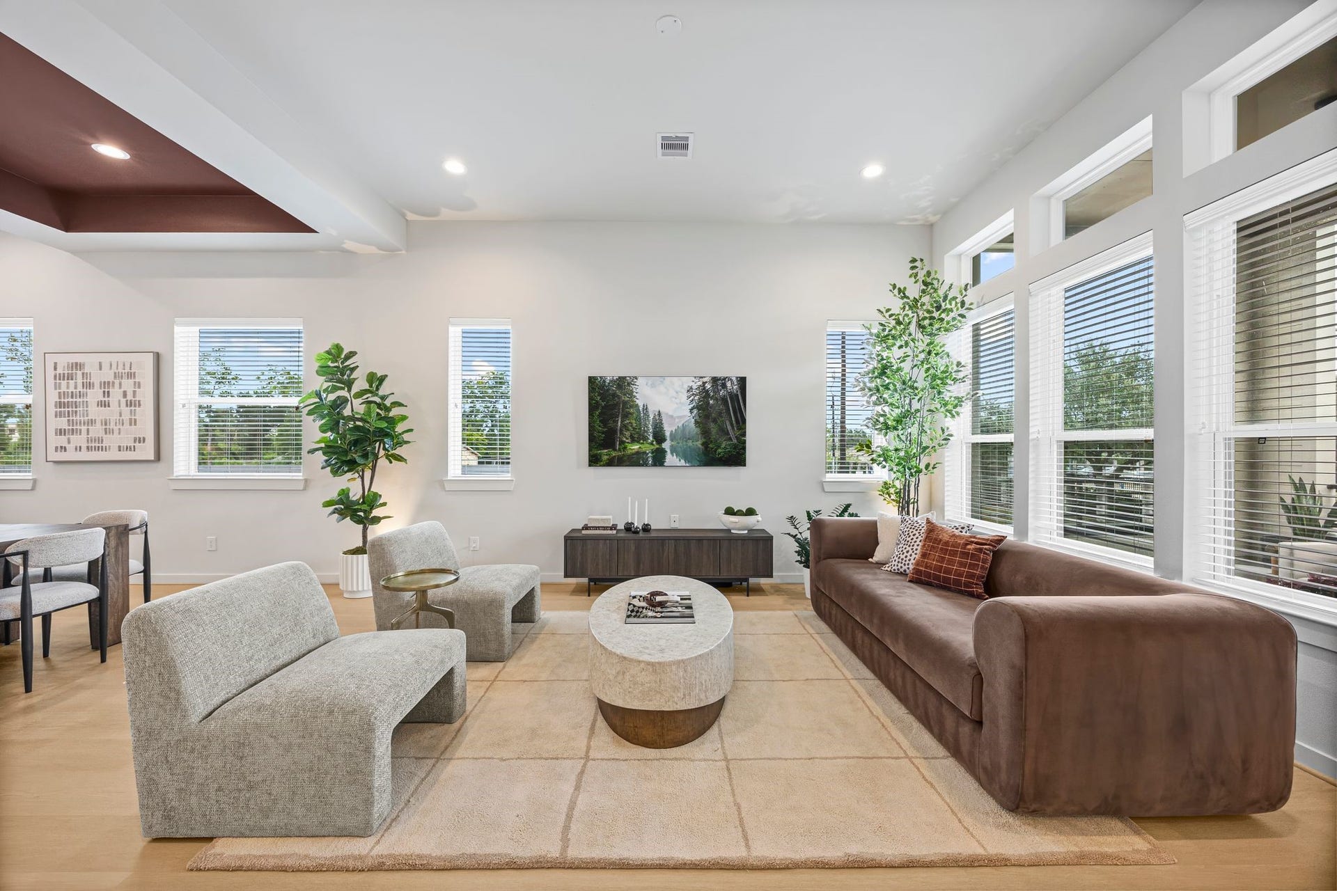 Bright and inviting, this living area is a perfect blend of modern elegance and comfort, featuring ample natural light, plush seating, and stylish decor for a welcoming atmosphere. **Model Home of similar layout & finishes.**