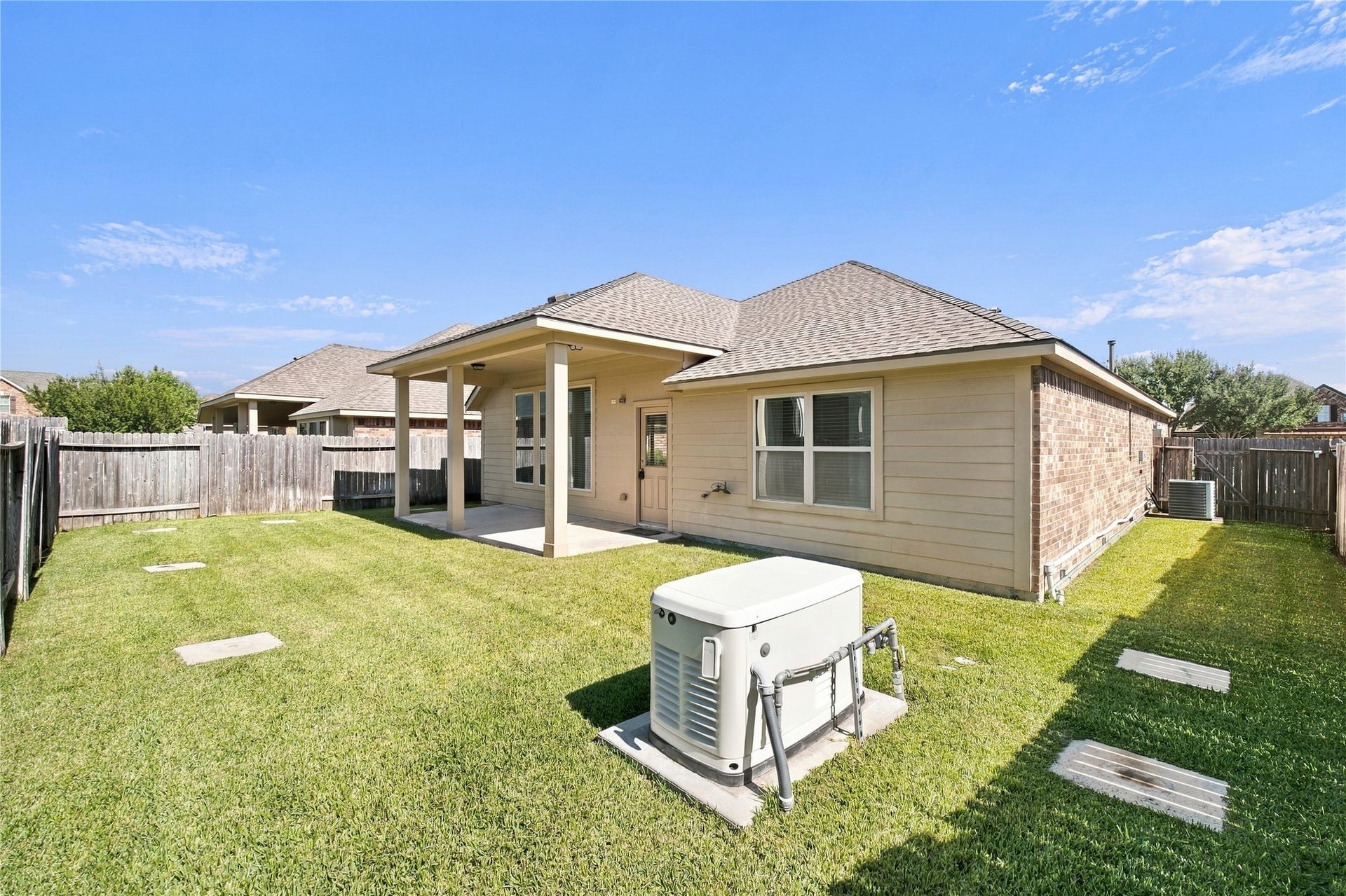 8119 W Pine Creek Bend, Cypress, TX 77433 The backyard offers space for outdoor play, gardening, and enjoying time outside.