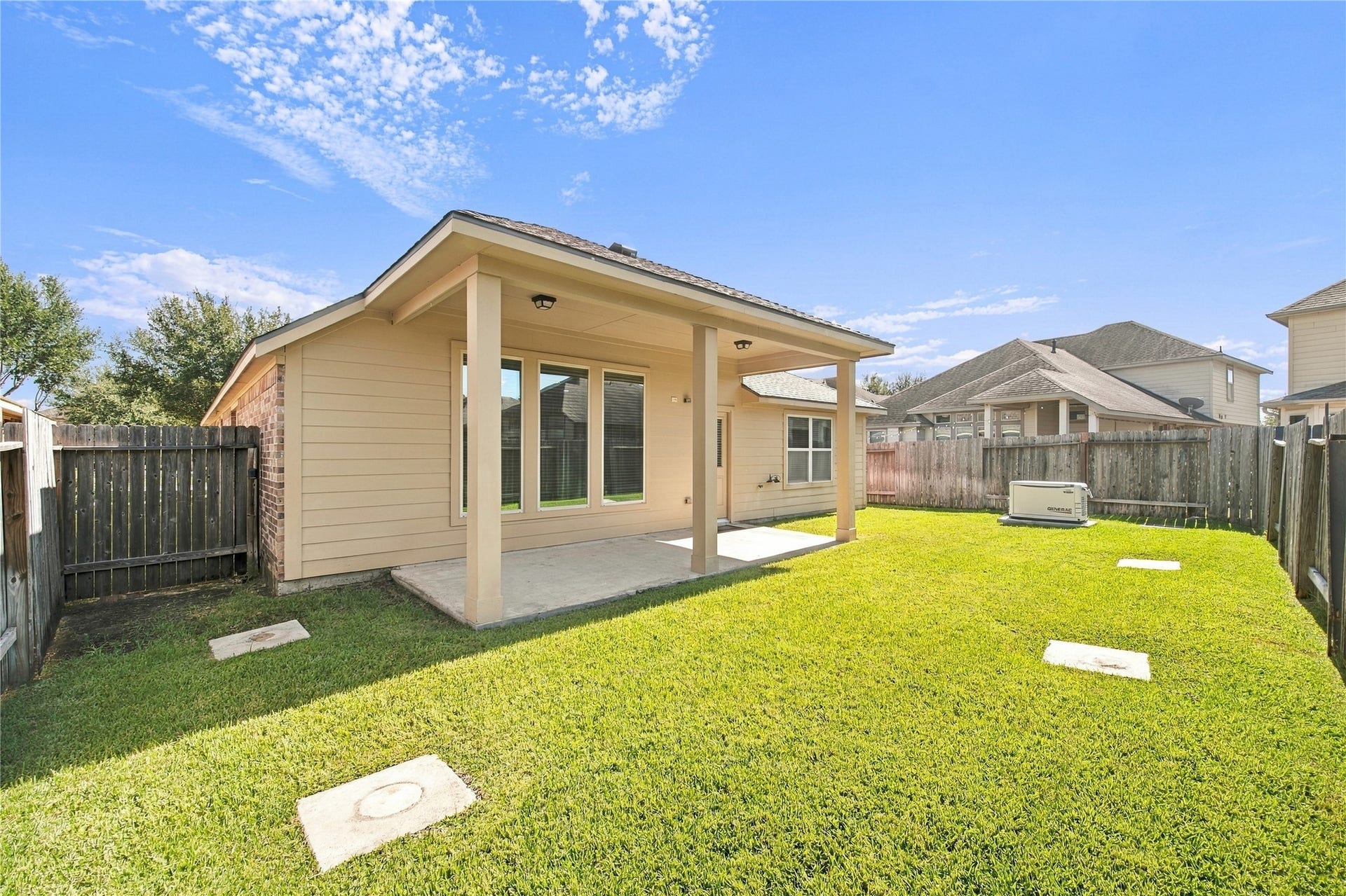 8119 W Pine Creek Bend, Cypress, TX 77433 The covered back patio offers a wonderful space to relax, unwind, and enjoy the outdoors.