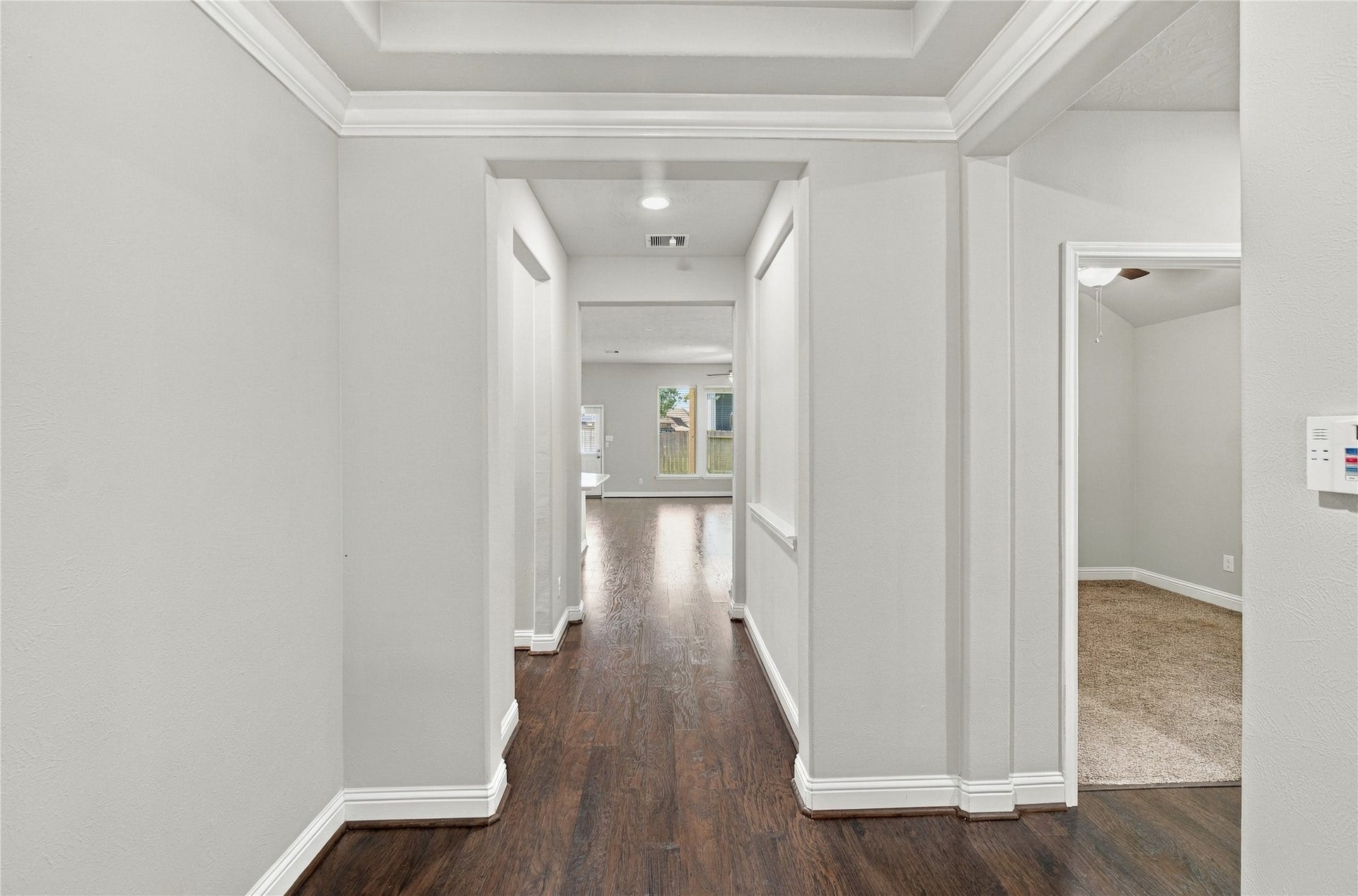 8119 W Pine Creek Bend, Cypress, TX 77433 Stepping through the front door, you are welcomed by beautiful wood flooring that flows throughout the home, creating a warm and cohesive feel.