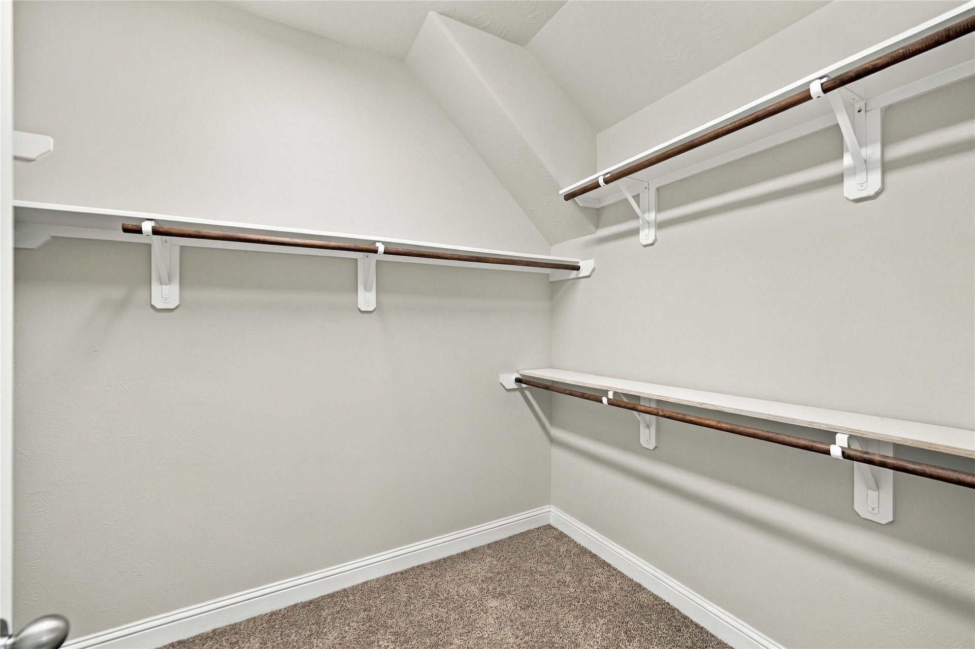 8119 W Pine Creek Bend, Cypress, TX 77433 The primary ensuite walk-in closet.