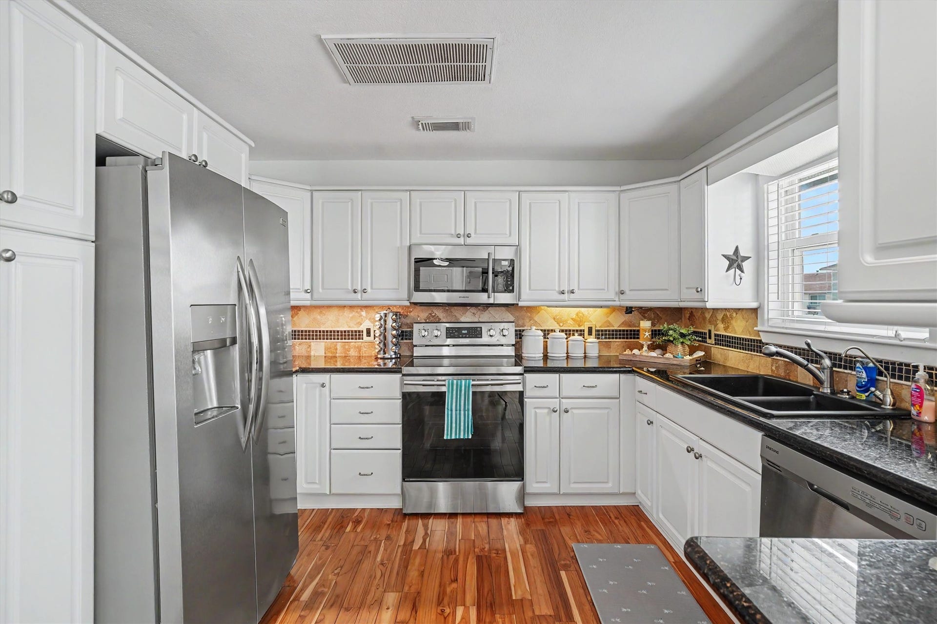 This kitchen is rare in Bayou Vista because it provides a ton of storage. The refrigerator stays with the home